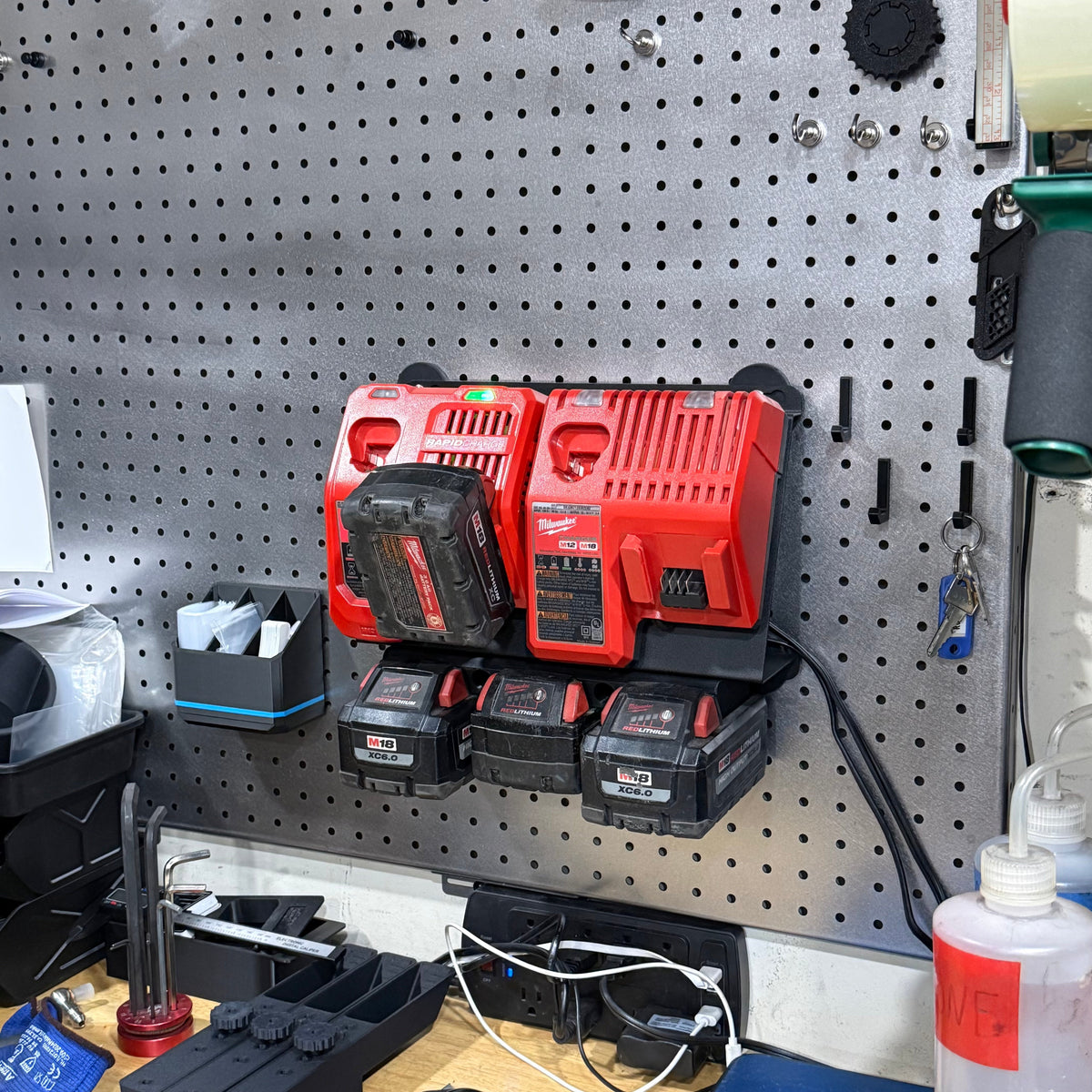 Milwaukee M18 M12 rapid battery charger wall mount plate with 20-degree angle, designed for van, truck, or workshop use.