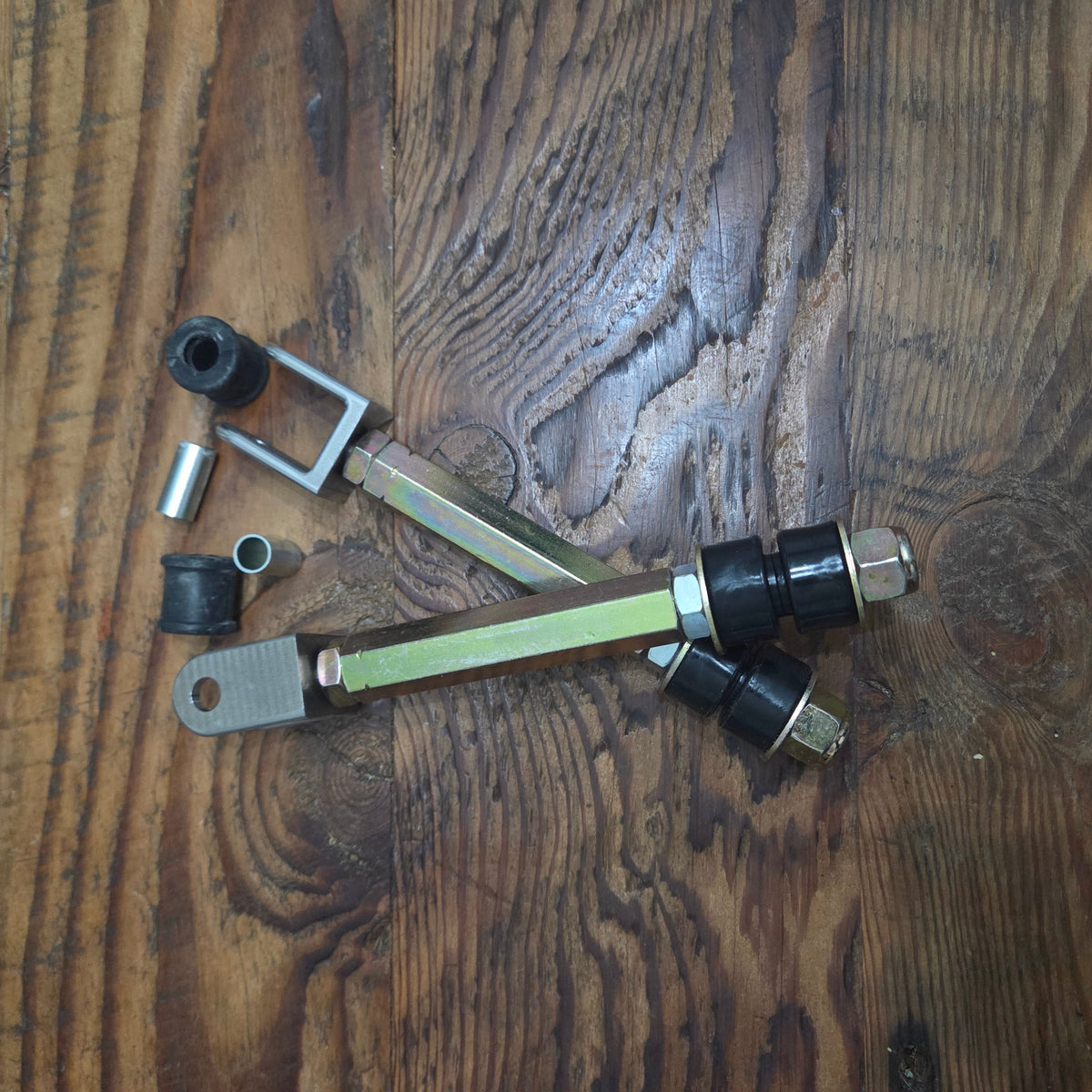 Overland Custom Design Land Cruiser sway bar links showing metal links and bushings for vehicle suspension upgrade