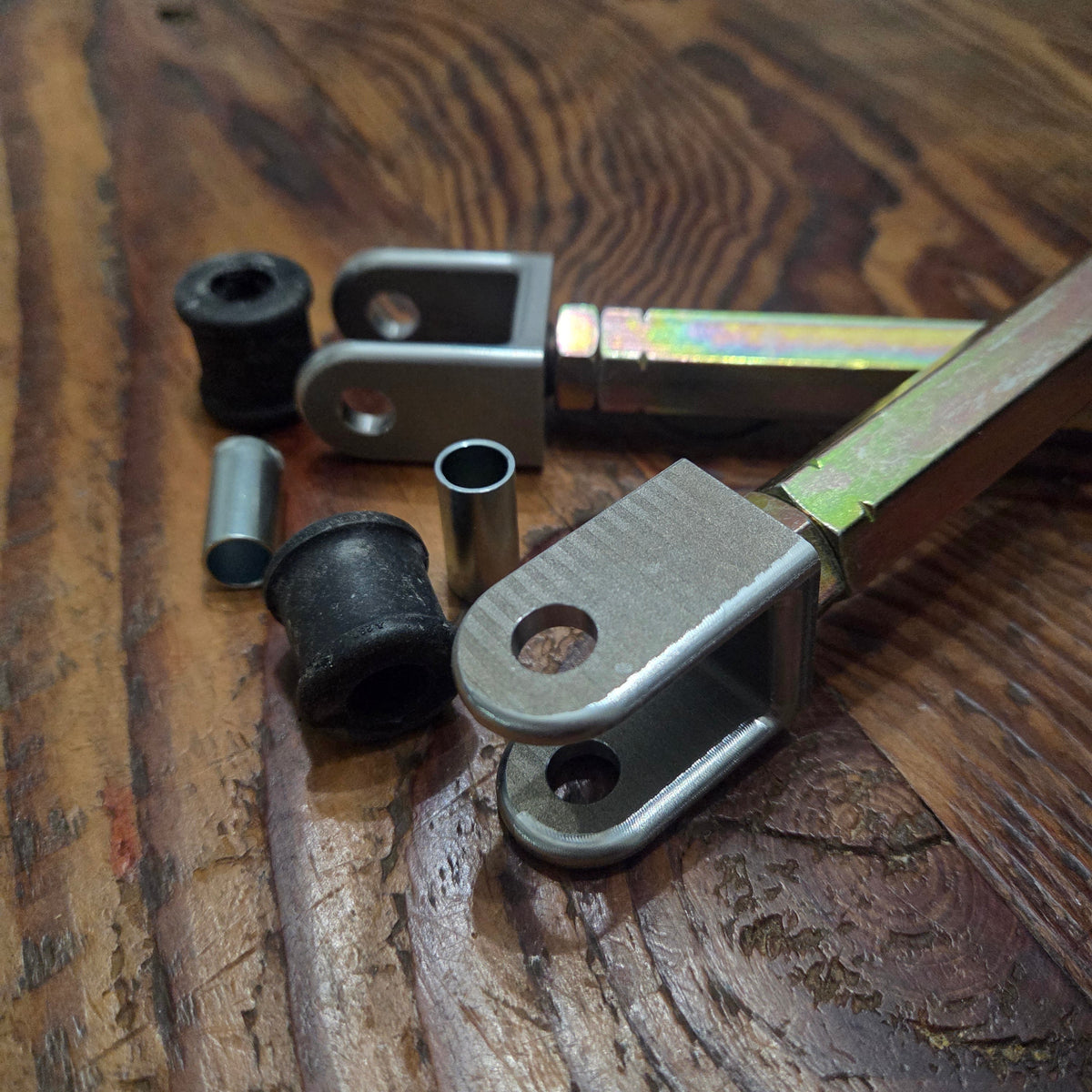 Overland Custom Design Land Cruiser sway bar links shown in close-up, showcasing durable metal construction for off-road stability.