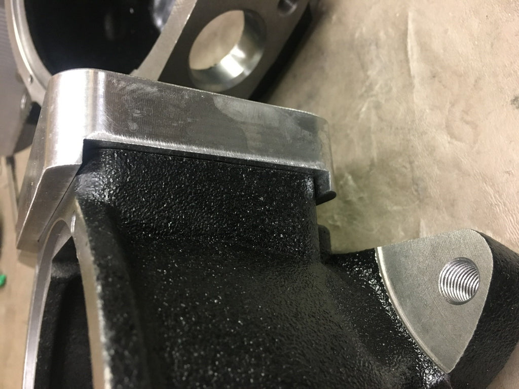 FJ80 High Steer Knuckle Kit with 25mm bearing upgrade for axles and drivetrain, by 4XNation, showing the assembled knuckles.