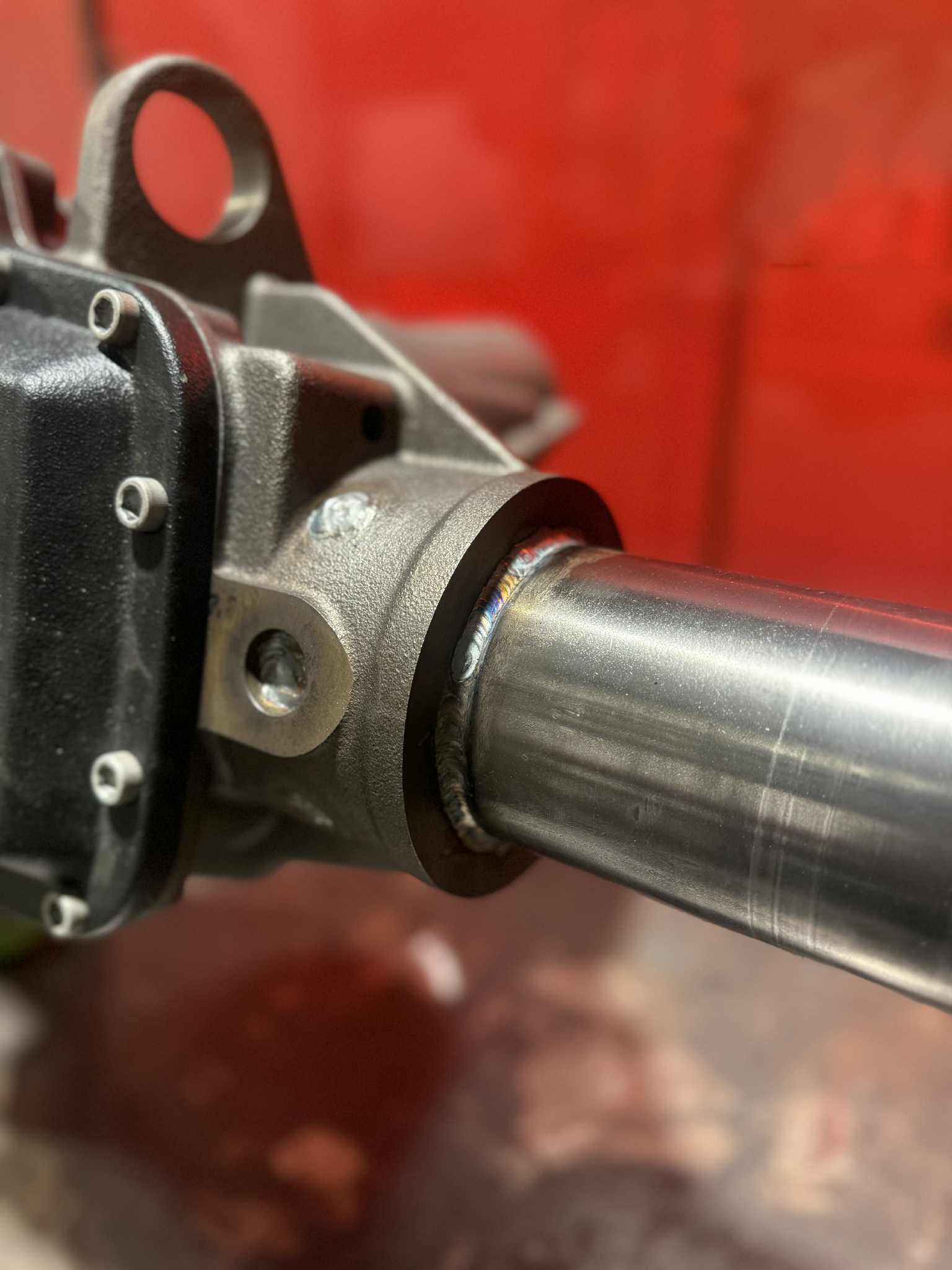 Toyota Front Dana 60 Axle Housing by 4XNation, heavy-duty drivetrain component with wheel mountings and robust construction.