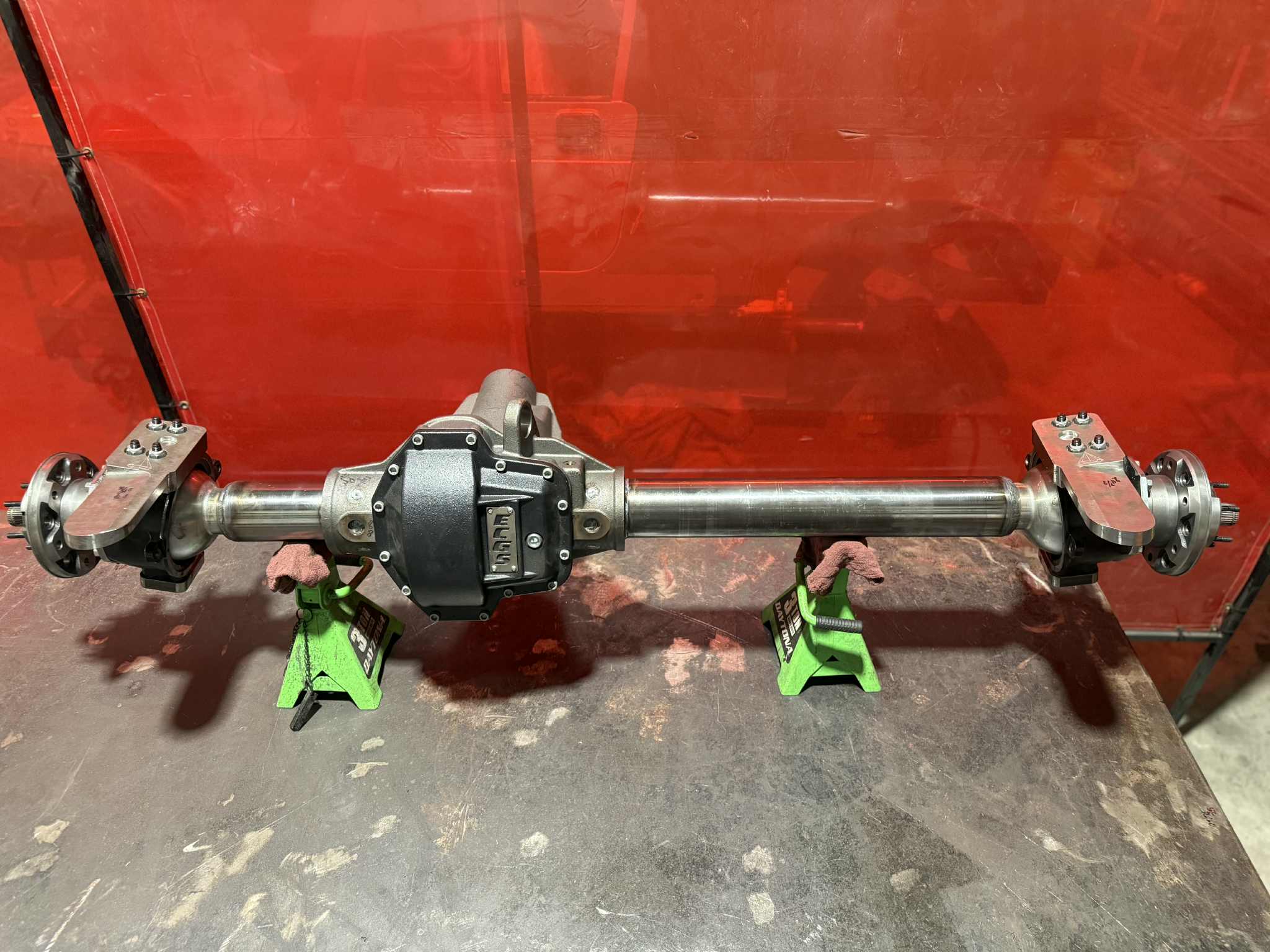 Toyota Front Dana 60 axle housing from 4XNation, showcasing the drivetrain component with mounting points and axle tube details.