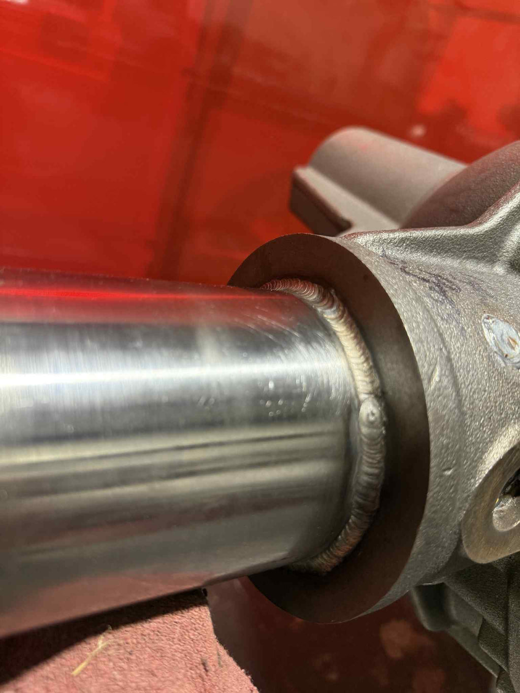 Toyota front Dana 60 axle housing by 4XNation, showing the drivetrain component with mounted axle and wheel hubs.