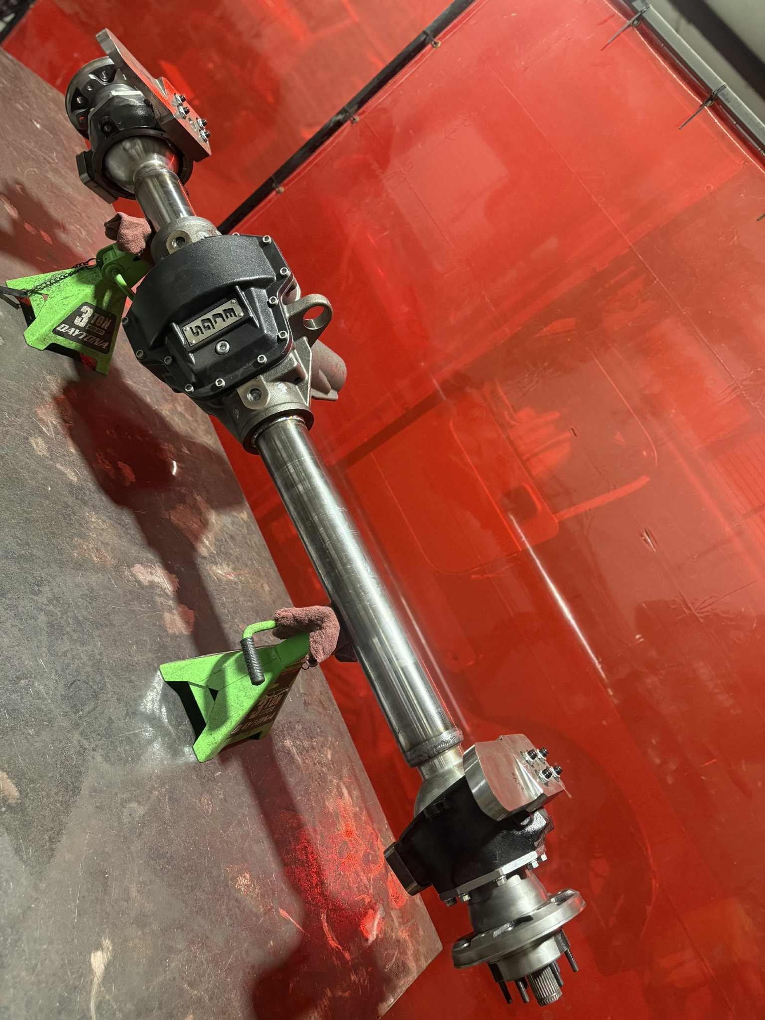 Toyota Front Dana 60 Axle Housing from 4XNation, heavy-duty drivetrain axle with wheel mounting surface and robust construction.