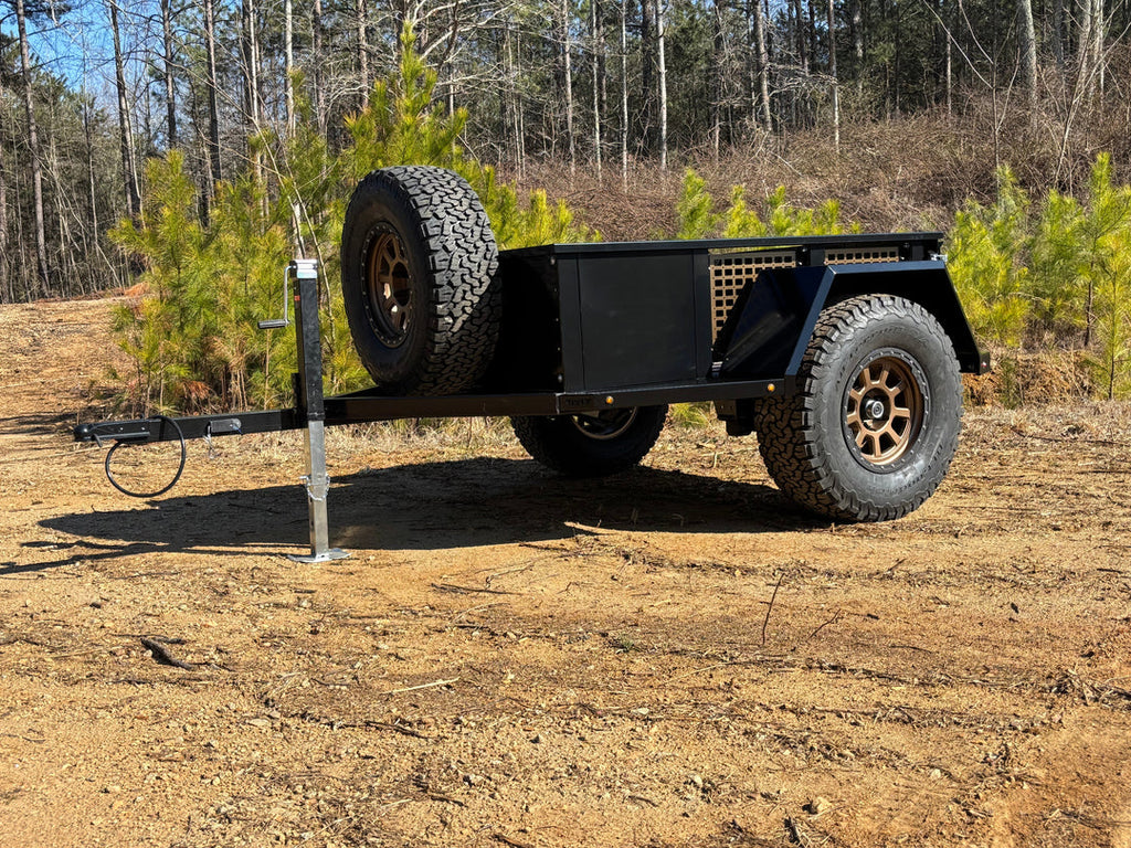 Weld-together DIY off-road overland trailer kit by 4XNation, featuring rugged components and ready for off-road adventures.