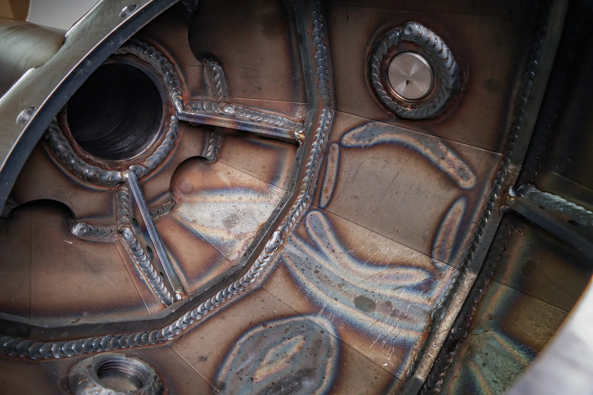 Bare tube of Riley Mountain Motorsports 8.75-inch rear axle housing for Toyota Tacoma 2016-2023, showing the axle tube and mounting points.