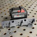 Elevate Metalcraft 3X M18 locking battery mount showing secure attachment and metal construction for power tool batteries.