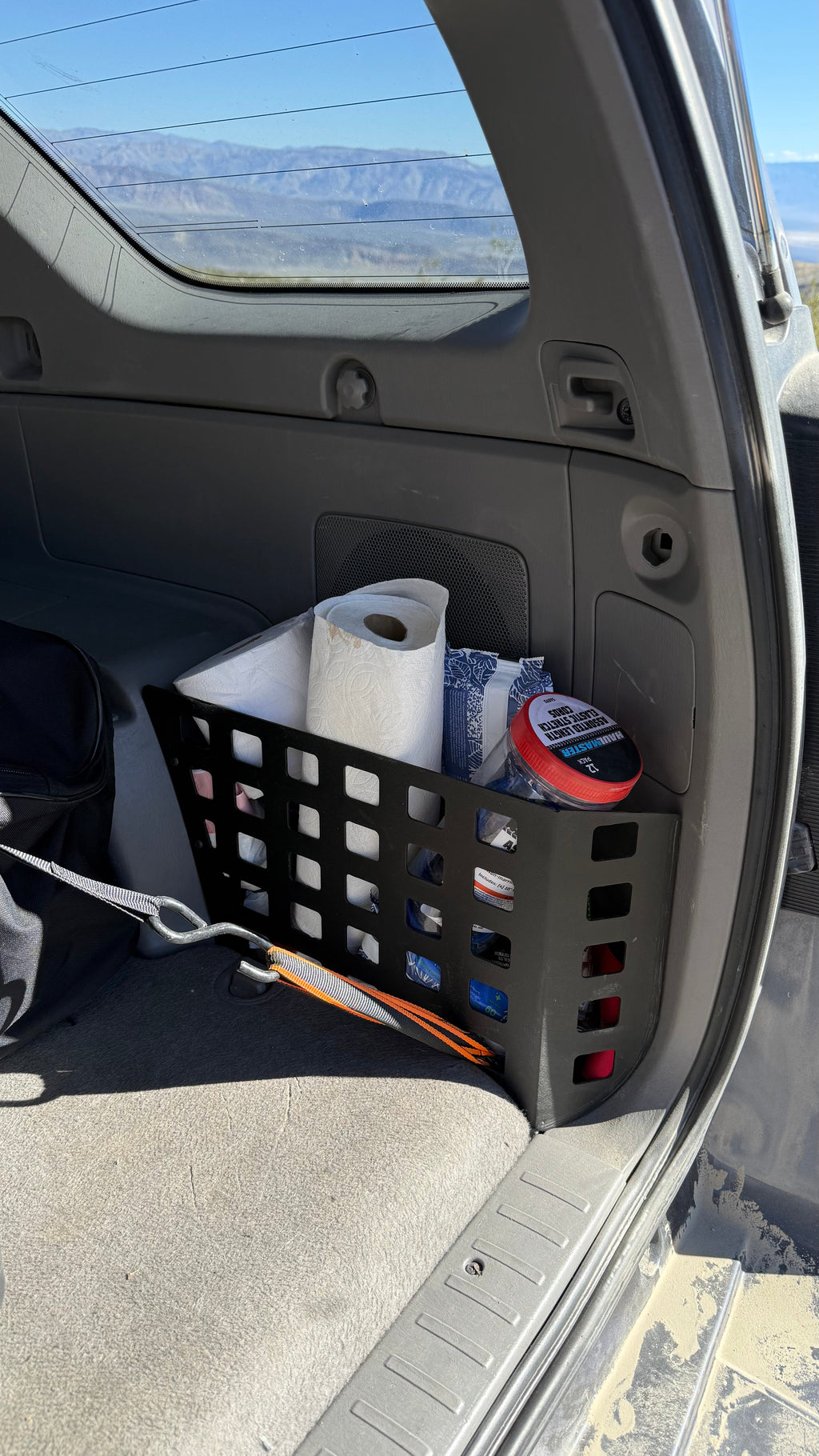Toyota 4Runner 2003-2009 rear storage Molle panel by Elevate Metalcraft, showing the metal panel with MOLLE webbing for gear attachment.