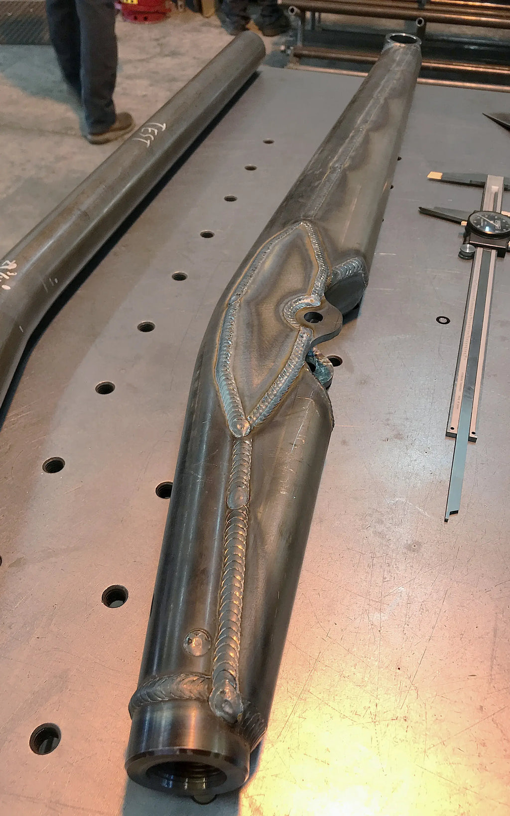 Pair of 40-inch URC single shock trailing arms by Riley Mountain Motorsports, showing the durable steel construction and mounting points.