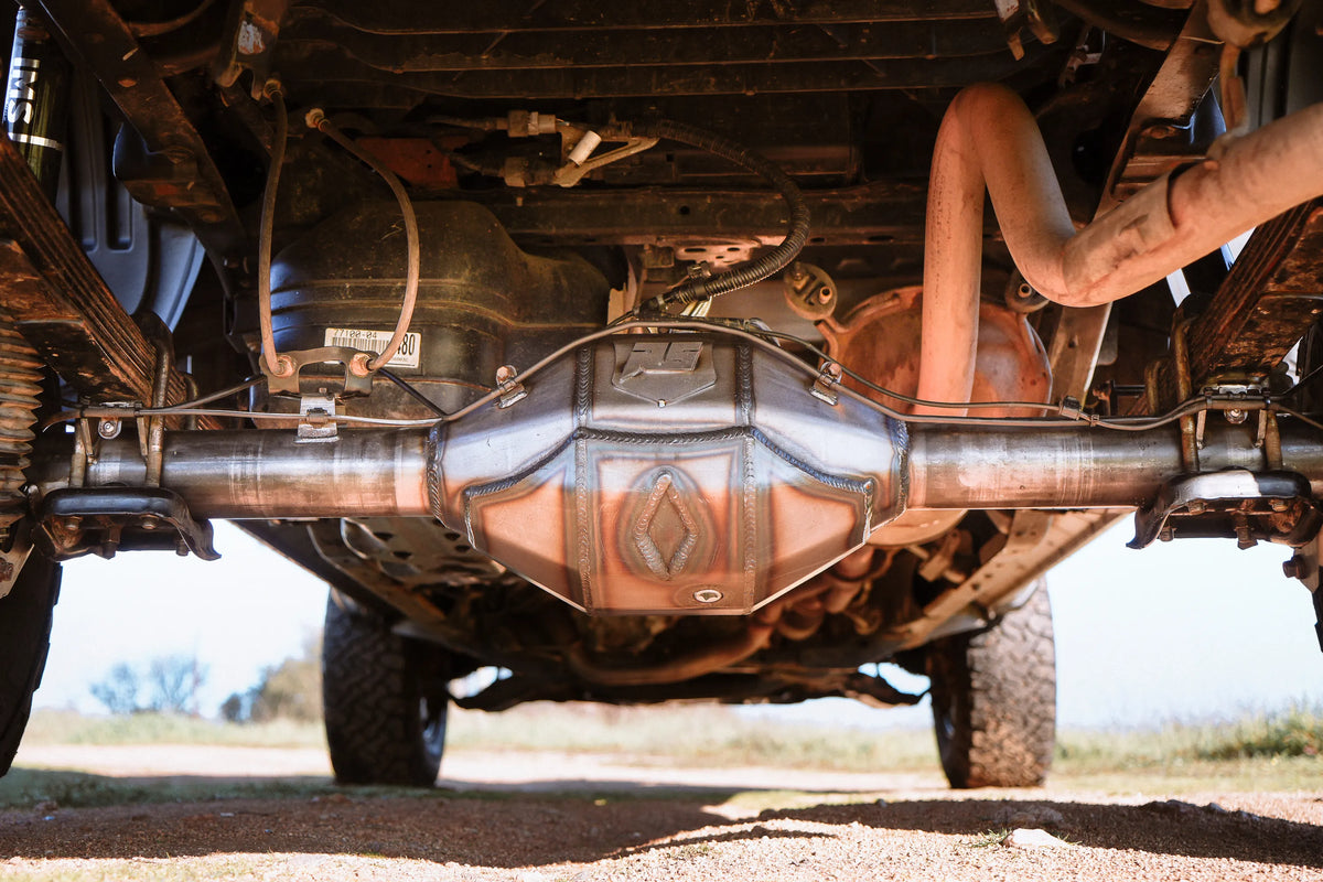 Toyota Tacoma 8.75-inch rear housing axle part by Riley Mountain Motorsports, shown on a black background.