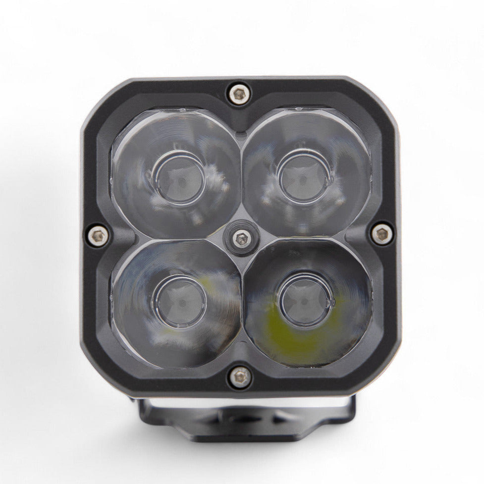GGLighting RP20 LED pod with clear lens, showing bright white light and compact design, ideal for automotive lighting applications