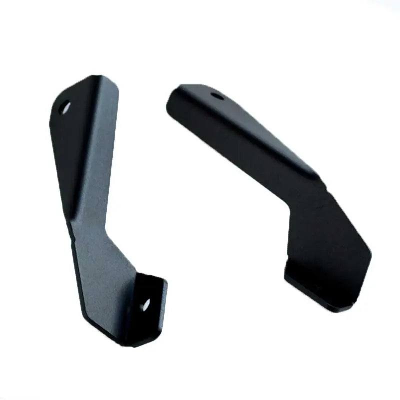 Toyota Hilux hood ditch light mounts by Apoc Industries, designed for 1988-1994 models, showing sturdy metal construction for off-road lighting.