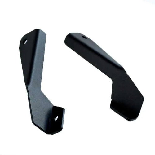 Toyota Hilux hood ditch light mounts by Apoc Industries, designed for 1988-1994 models, showing sturdy metal construction for off-road lighting.