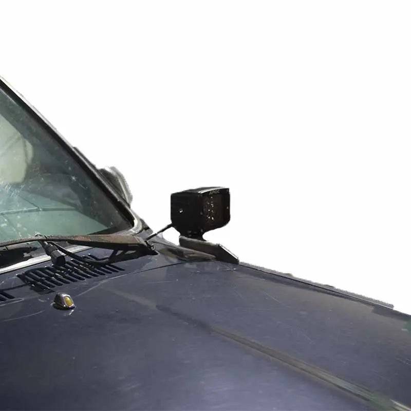 Toyota Hilux hood ditch light mounts by Apoc Industries, designed to securely hold ditch lights on 1988-1994 models.