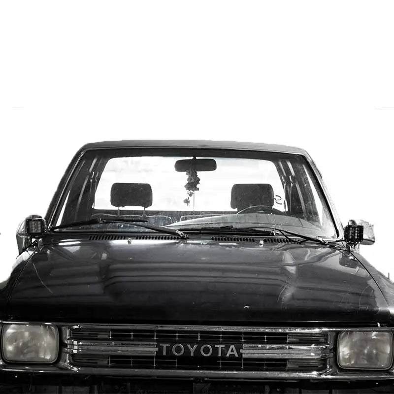 Toyota Hilux 1988-1994 hood ditch light mounts by Apoc Industries, designed for secure installation of off-road lights on the hood.