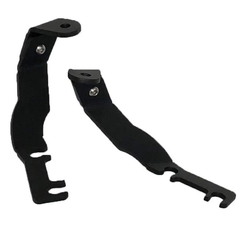 Toyota Tacoma 1995-2004 hood ditch light mounts by Apoc Industries, showing black metal brackets for off-road lighting installation.