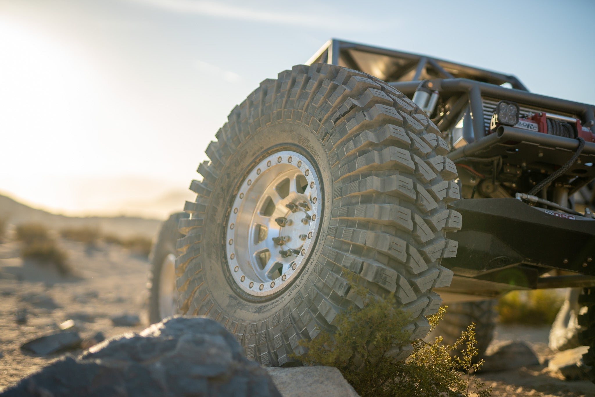 Battle Born Wheels Sierra forged simulated 17x9 inch Jeep wheel with 5x5 and 13.4 bolt pattern, machined finish, drain holes, and ring detail.