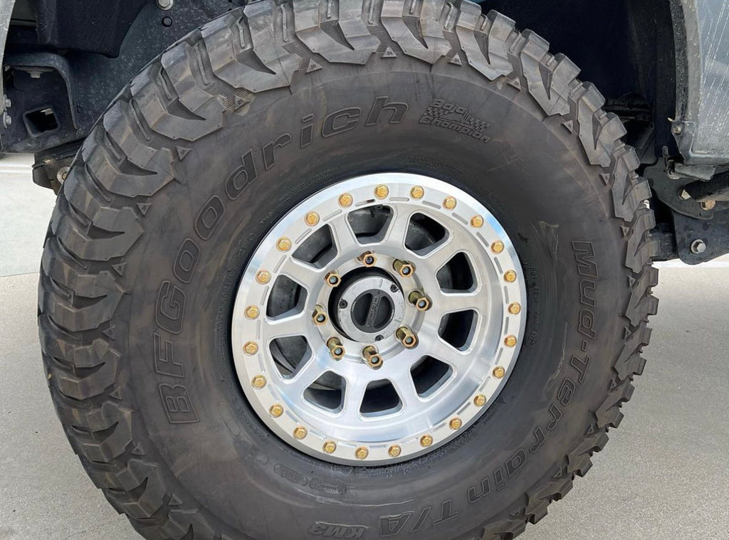 Battle Born Wheels Sierra forged simulated 17x9 inch Jeep wheel with 5x5.13 bolt pattern, machined finish, and simulated ring design.