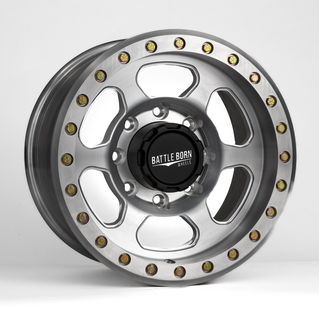 Battle Born Wheels X-RAY forged 17x9 Jeep wheel with simulated drain holes and machined finish, designed for off-road vehicles.