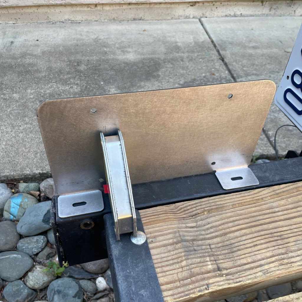 Heavy-duty steel bottom top license plate holder for trailers, RVs, and semi-trailers, designed for bolt-on installation by Elevate Metalcraft.