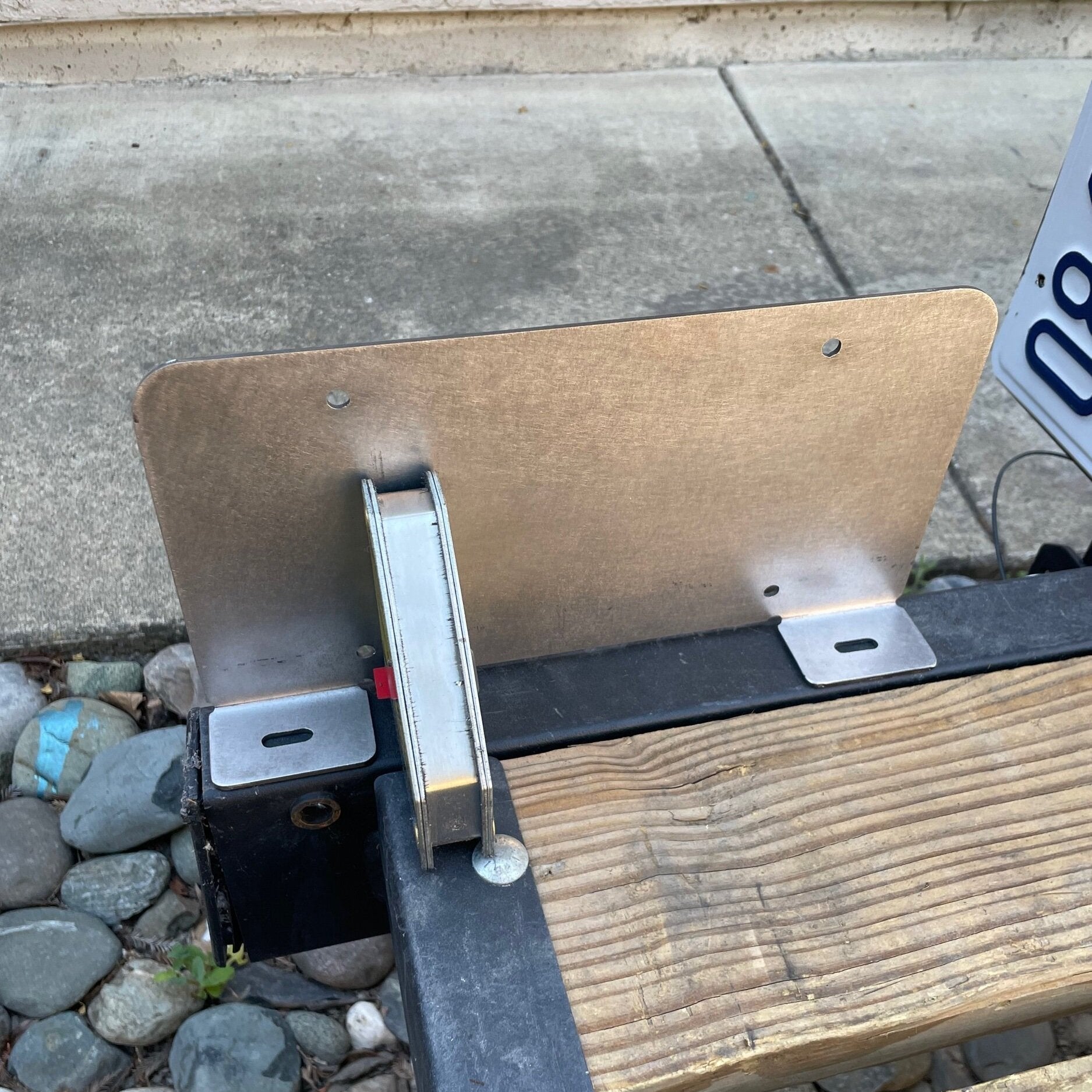 Heavy-duty steel bottom top license plate holder for trailers, RVs, and semi-trailers, designed for bolt-on installation by Elevate Metalcraft.