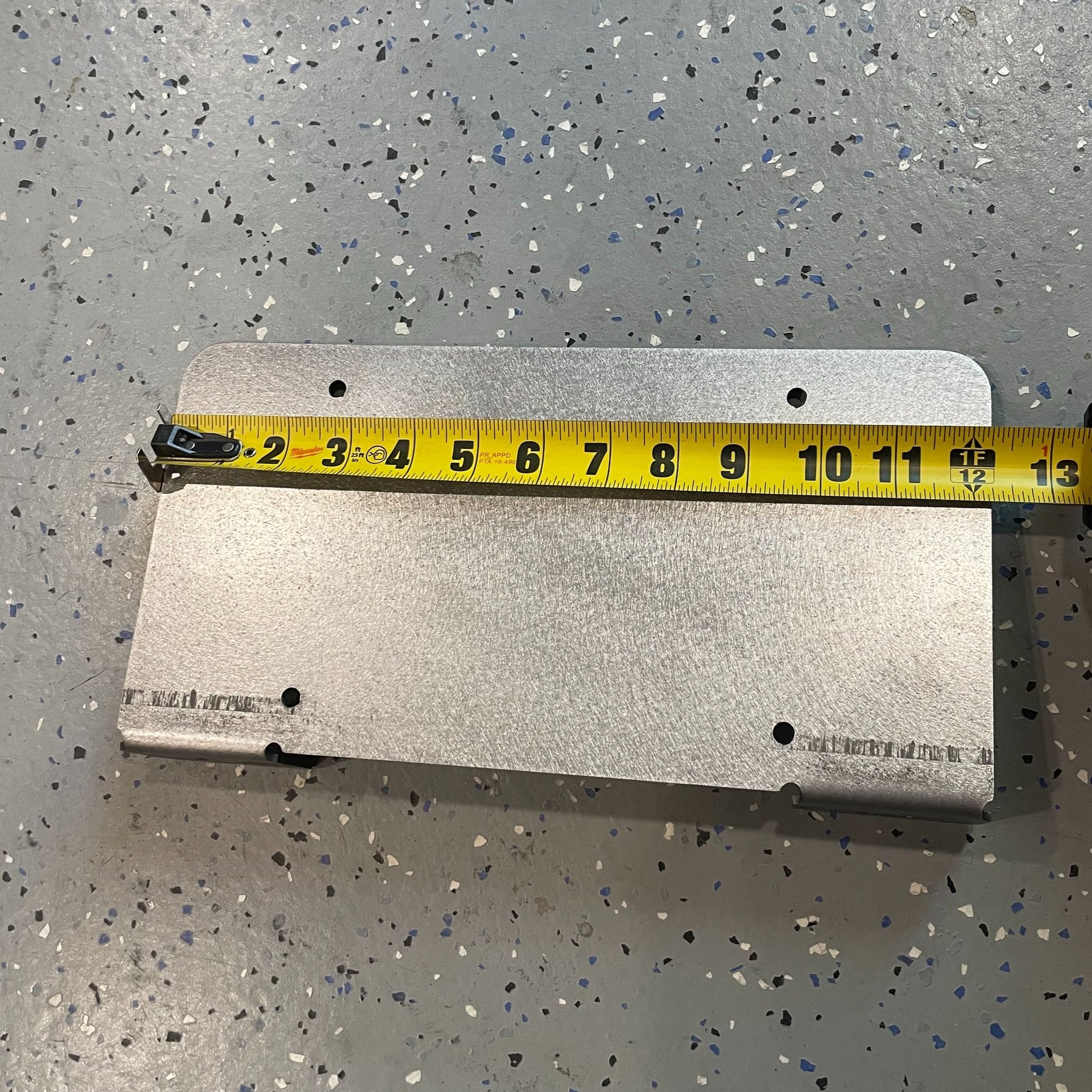 Heavy-duty steel bottom top license plate holder for trailers, RVs, and semi-campers by Elevate Metalcraft.