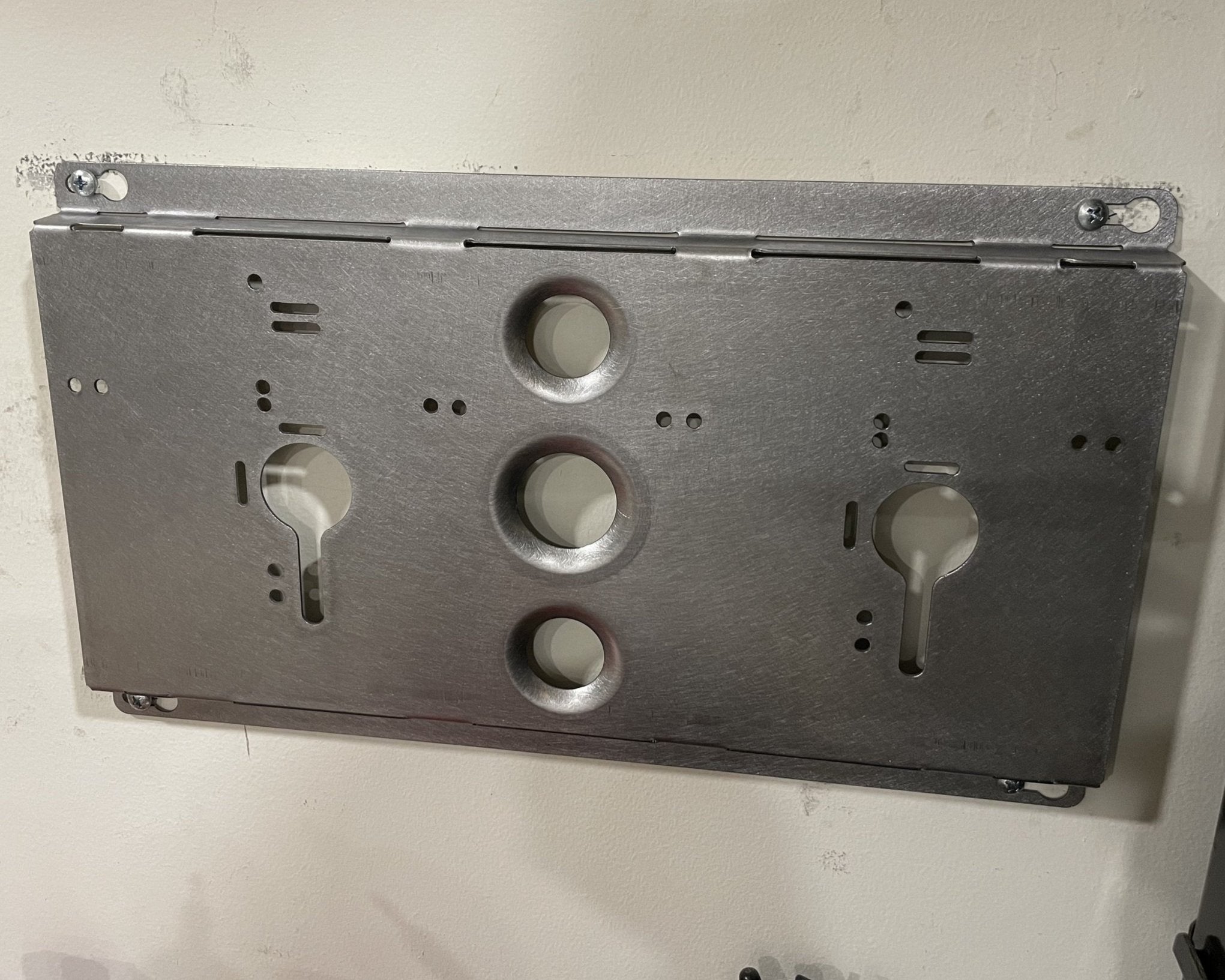 Elevate Metalcraft double charger wall mount plate with Milwaukee and DeWalt ridged design for van, truck, or contractor shop use.
