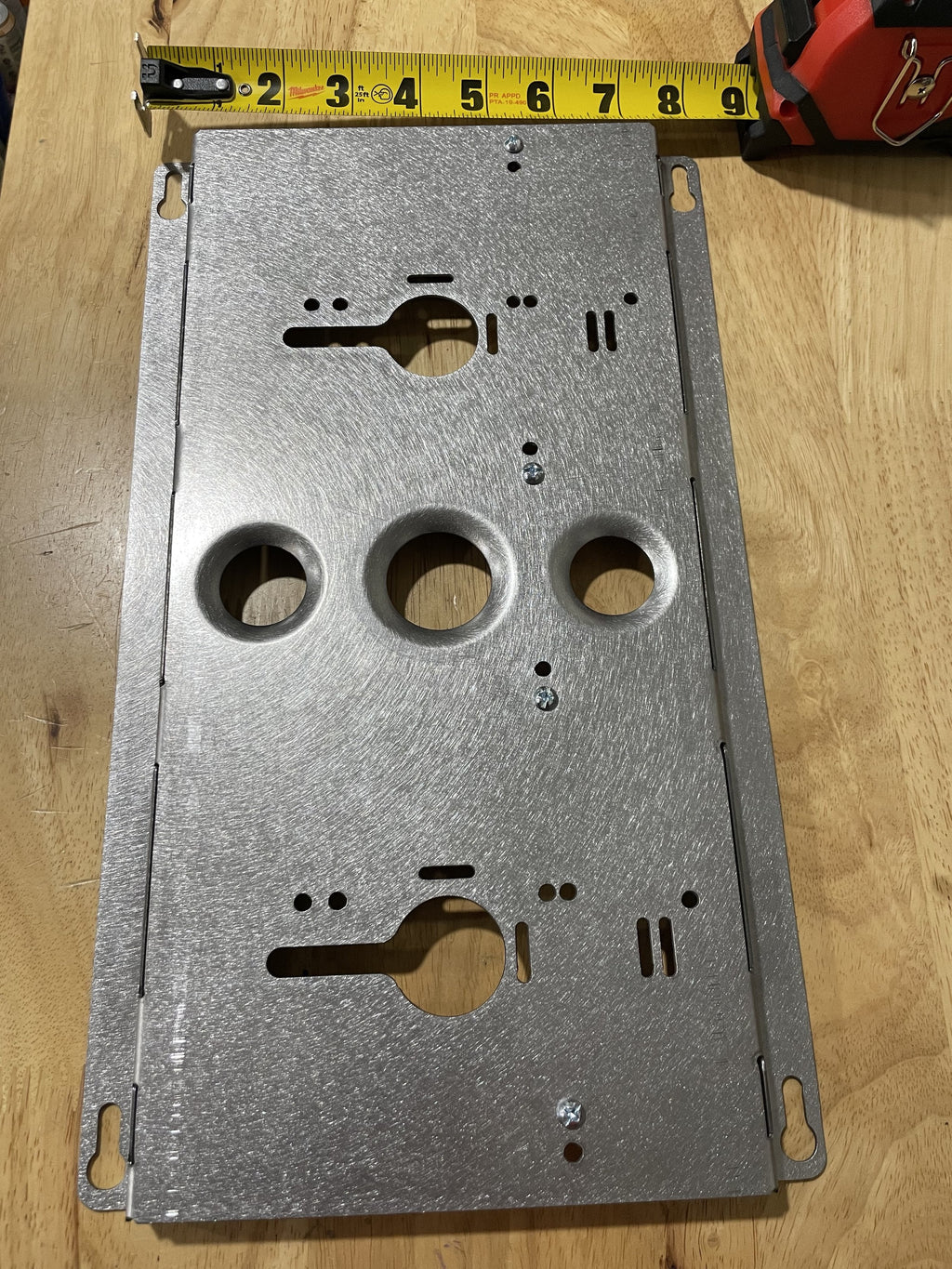 Double charger wall mount plate by Elevate Metalcraft for Milwaukee and DeWalt tools, suitable for van, truck, or shop use.