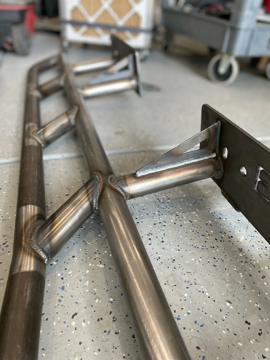 Lexus GX470 2003-2009 rock slider bolt-on frame mount plate set by Elevate Metalcraft, showing the sturdy metal plates for protection.
