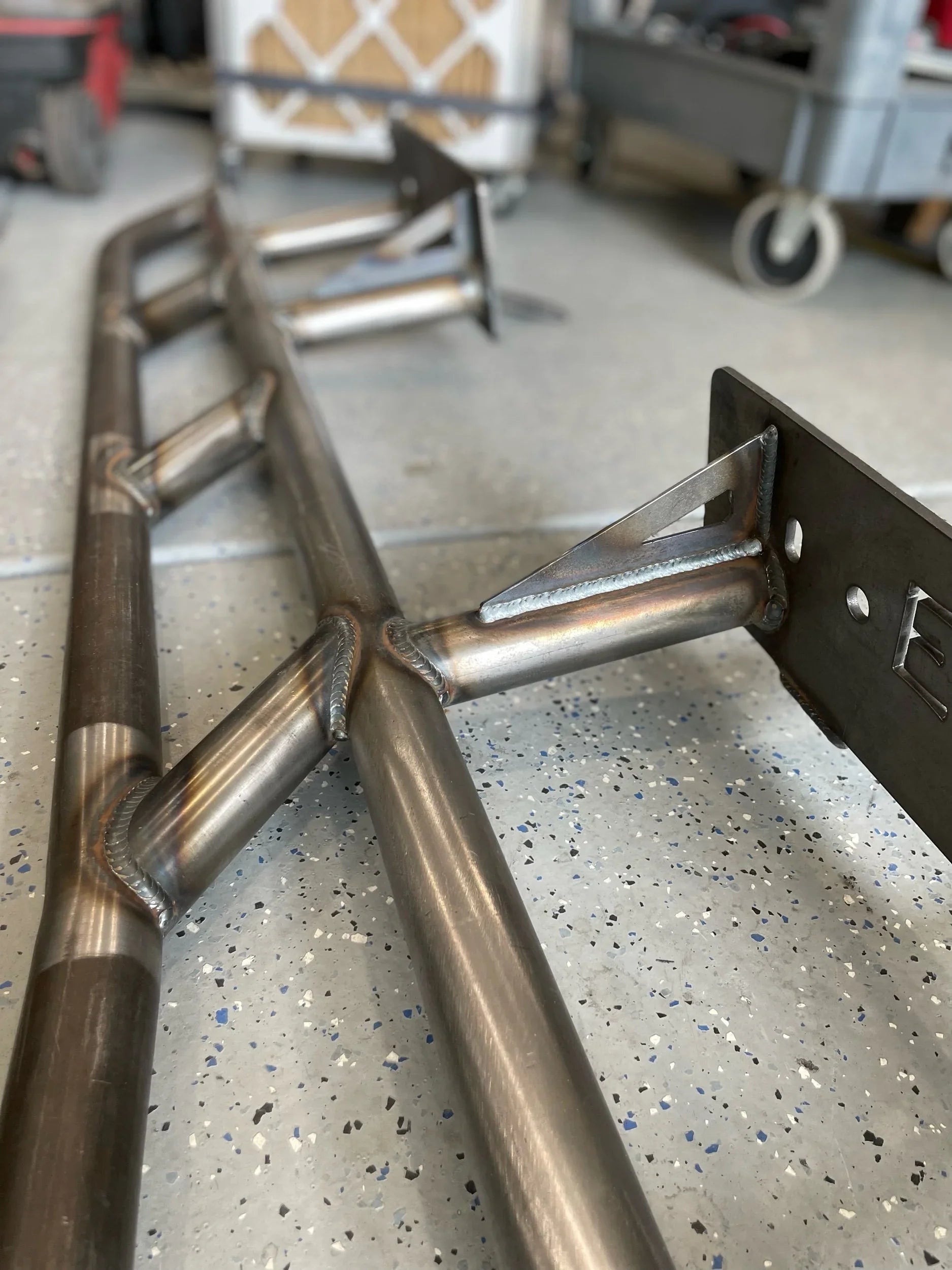 Lexus GX470 2003-2009 rock slider bolt-on frame mount plate set by Elevate Metalcraft, showing the sturdy metal plates for protection.