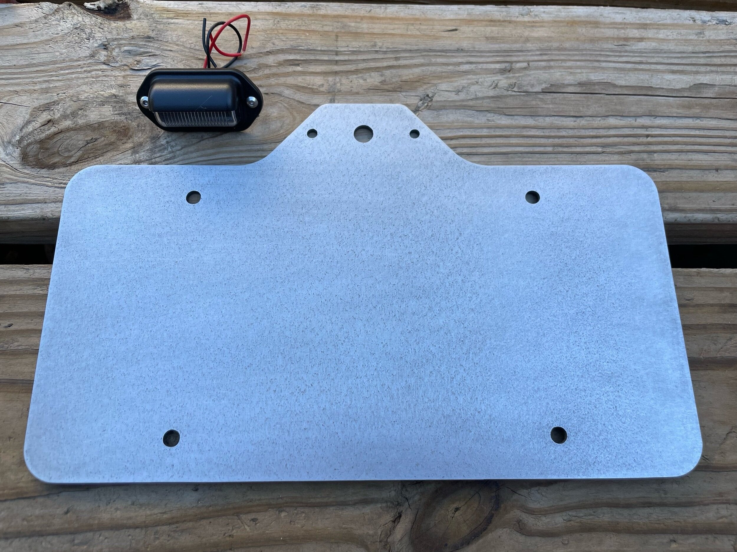 Heavy-duty steel license plate holder mount for trailers, RVs, and campers with LED light by Elevate Metalcraft.