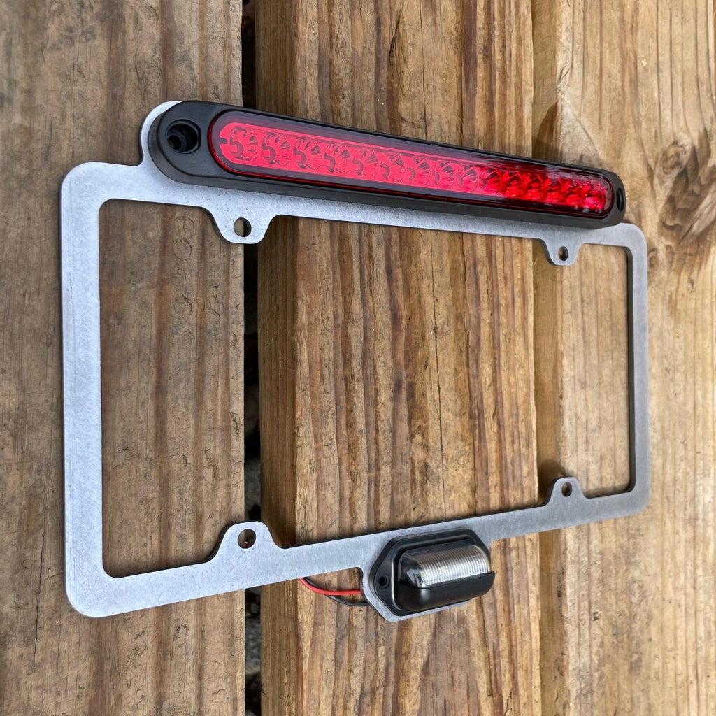 Elevate Metalcraft license plate relocation frame with 3rd brake light weld-on for 1.5 and 1.75 tubing, designed for easy installation.
