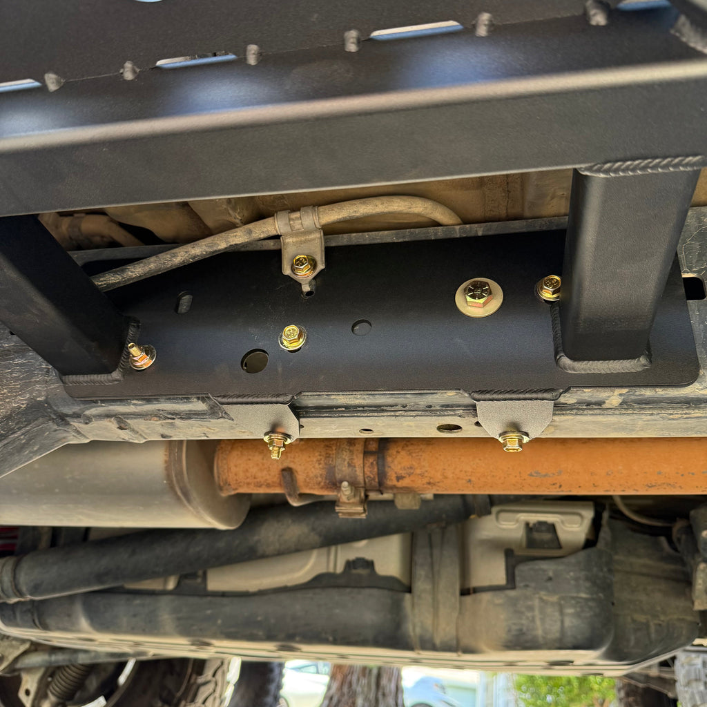 Toyota 4Runner 2003-2009 rock slider bolt-on frame mount plate set by Elevate Metalcraft, shown installed on vehicle frame.
