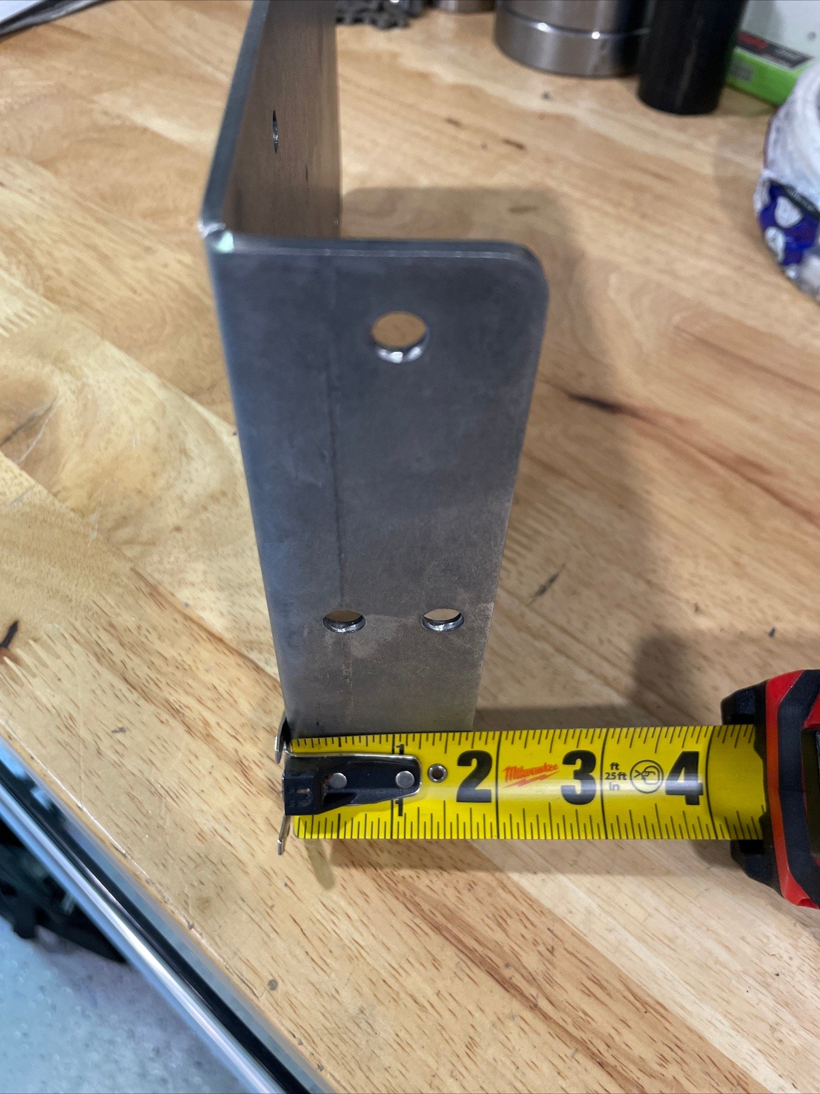 Heavy-duty steel side mount license plate holder for trailers, RVs, and semi-trailers, with LED light, from Elevate Metalcraft.