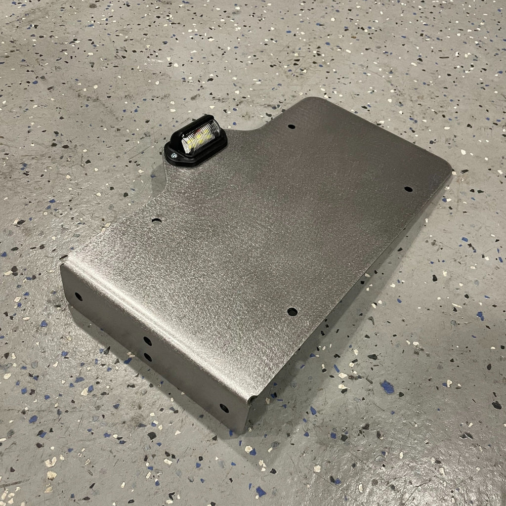 Heavy-duty steel side mount license plate holder for trailer, RV, or semi, with LED light on right side by Elevate Metalcraft.