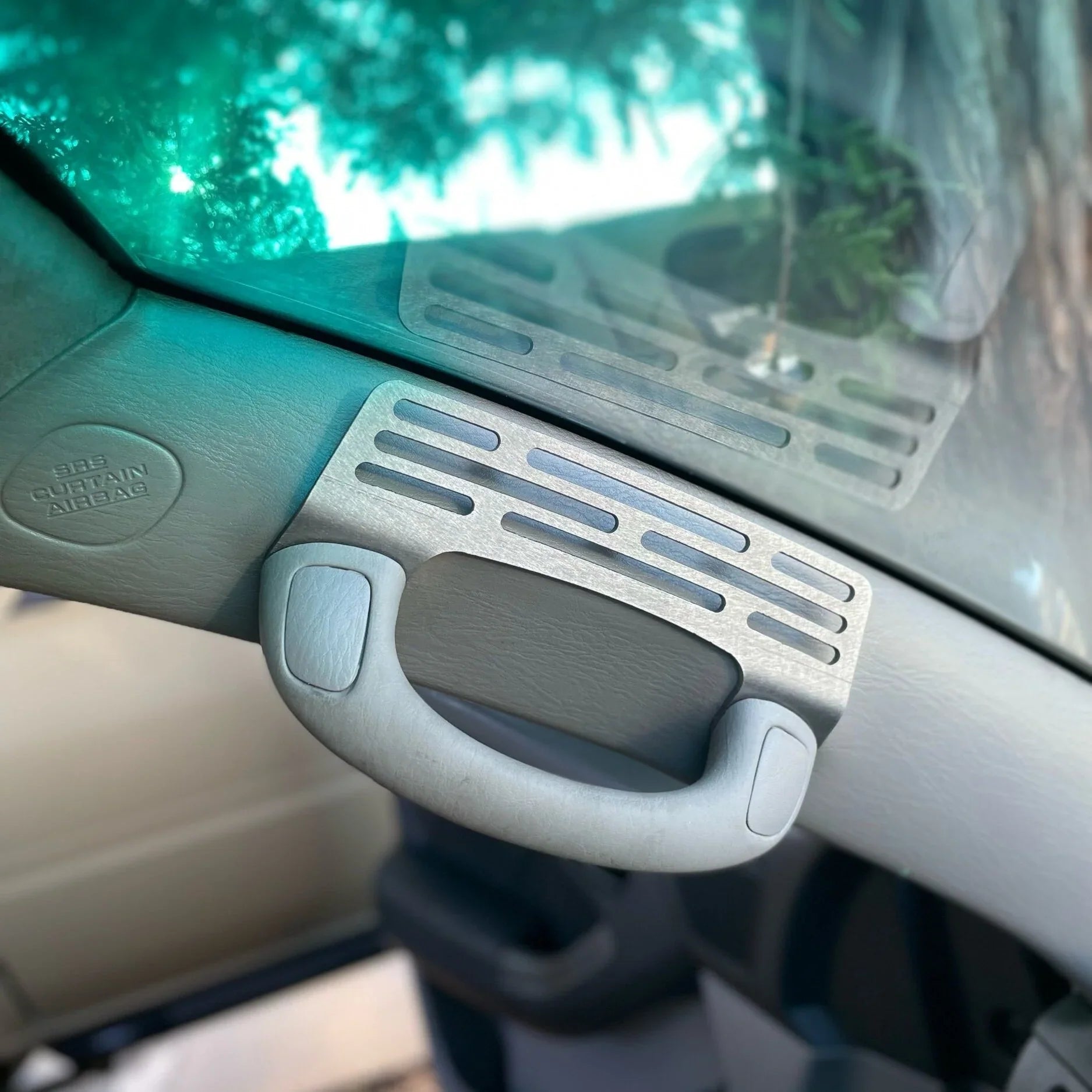 Black Elevate Metalcraft A-Pillar Grab Handle Accessory Mount for Lexus GX470, holds phones, ham radios, switches, and winch controllers.