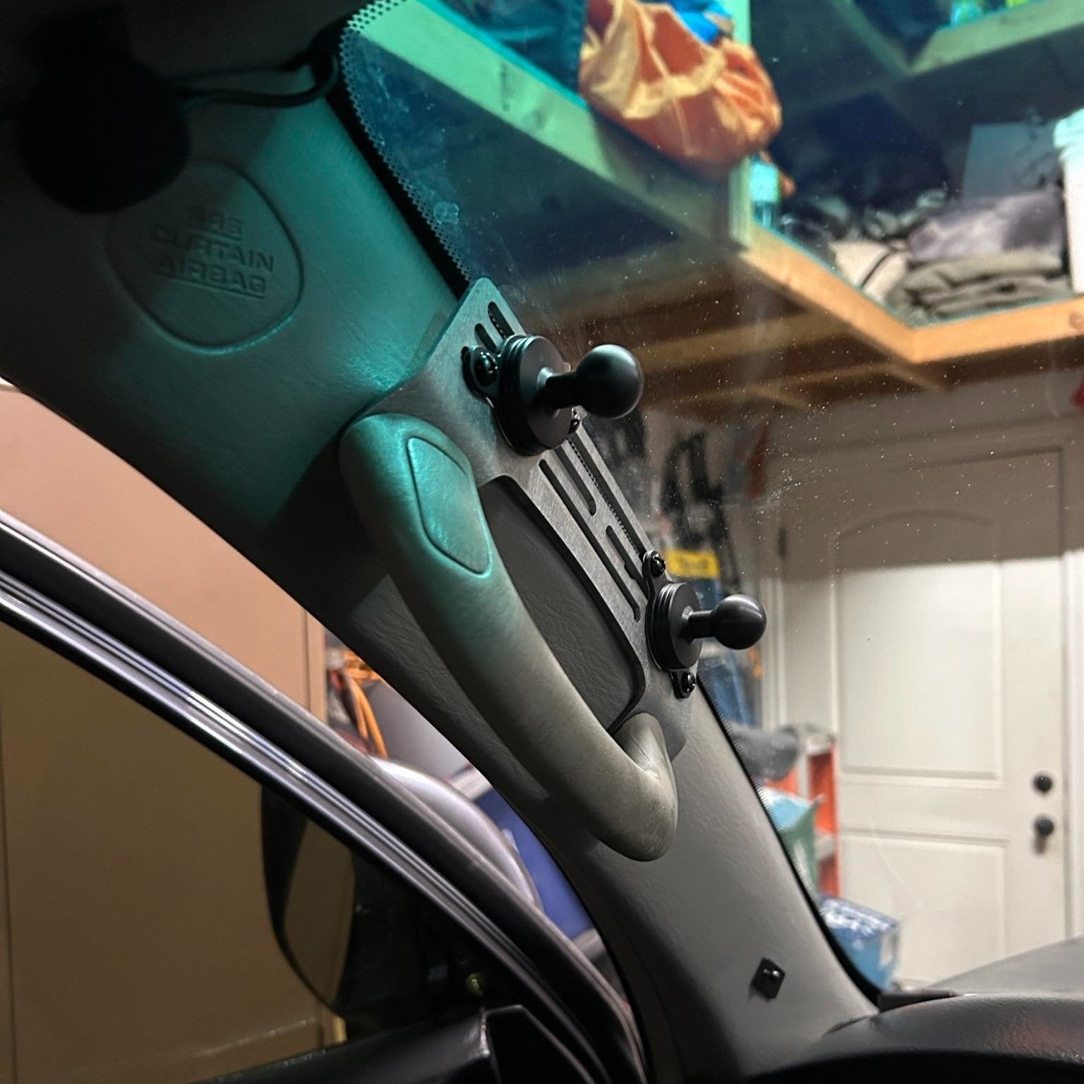 Elevate Metalcraft A-Pillar Grab Handle Accessory Mount on a 2003-2009 Toyota 4Runner 4th gen, for phones, radios, and switches.