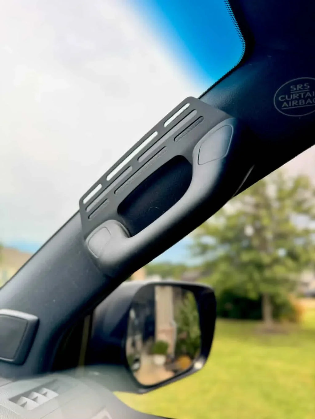 Elevate Metalcraft A-Pillar Grab Handle Accessory Mount in raw tumbled steel on a Lexus GX460, holding phone, radio, and switch accessories.