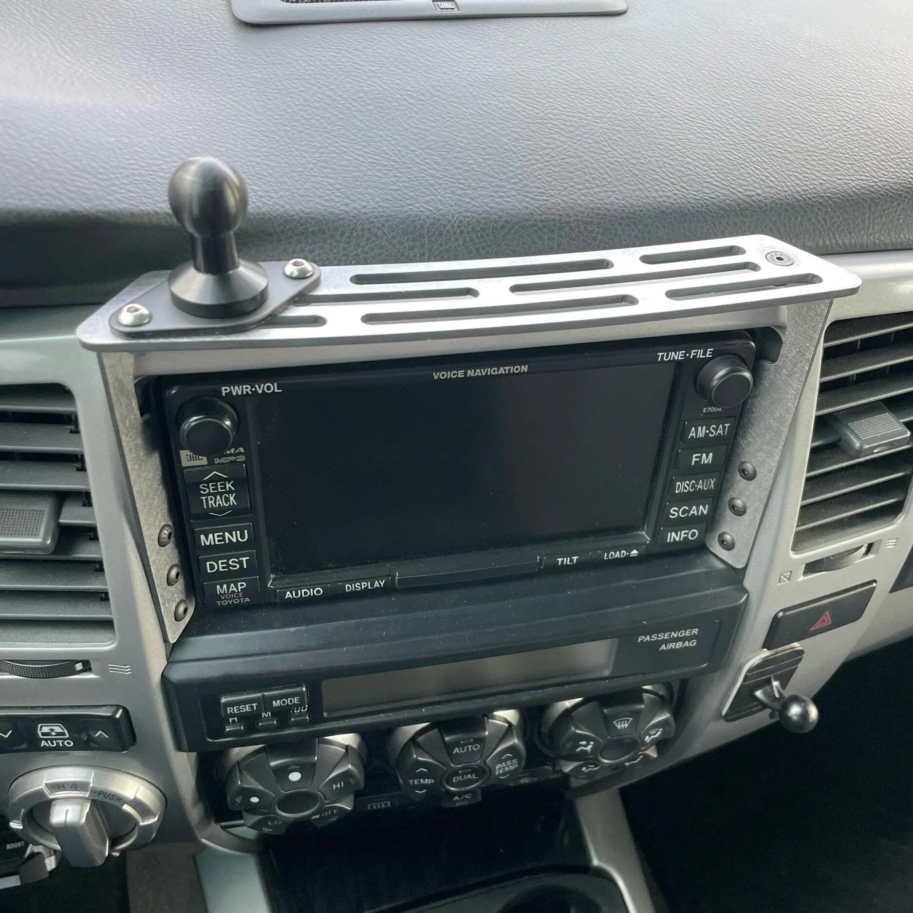 Elevate Metalcraft dash mount for 2003-2009 Toyota 4Runner, made of raw tumbled steel, holds AMP phone, tablet, and radios.