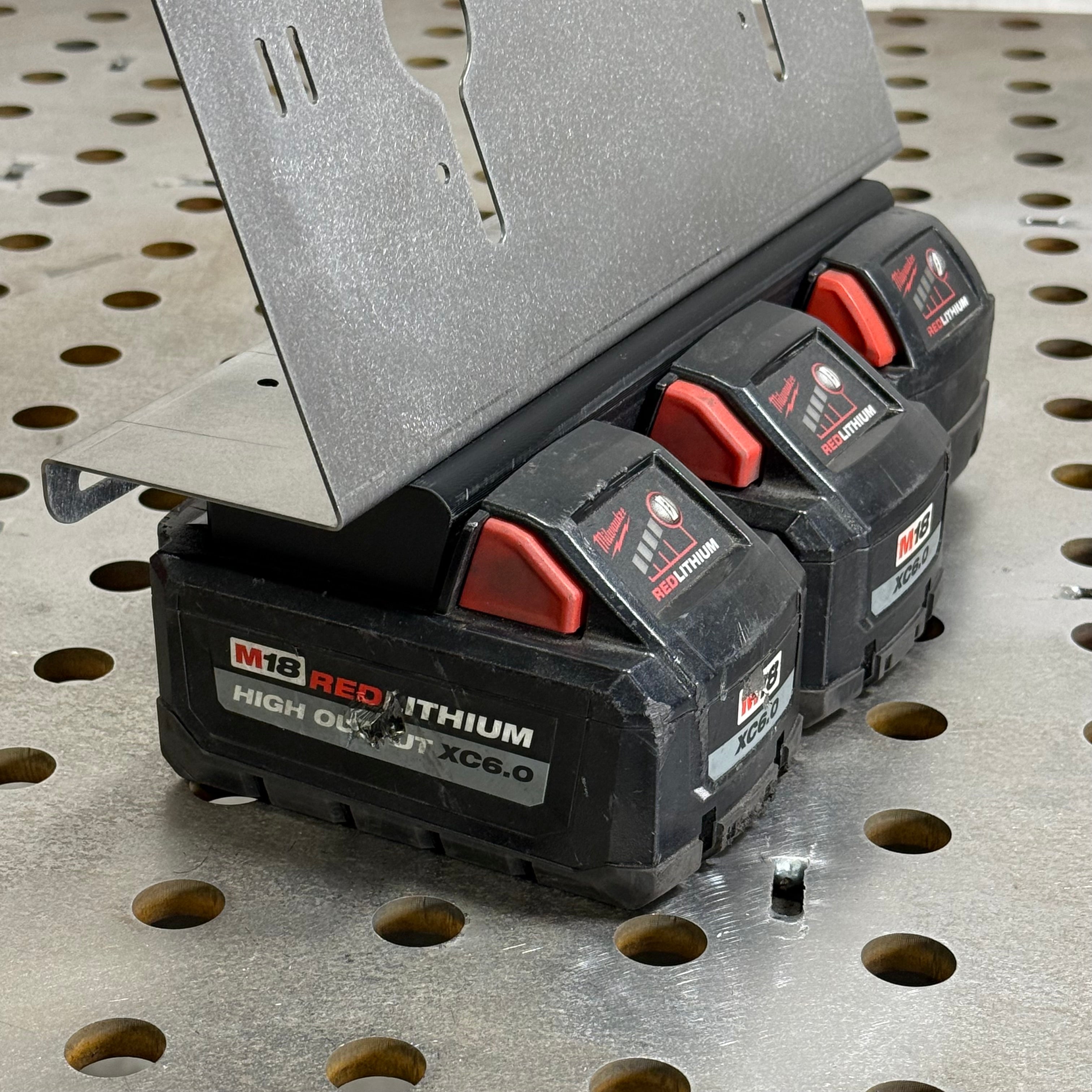 Elevate Metalcraft 3X M18 locking battery mount for secure attachment of M18 batteries to equipment or vehicles.
