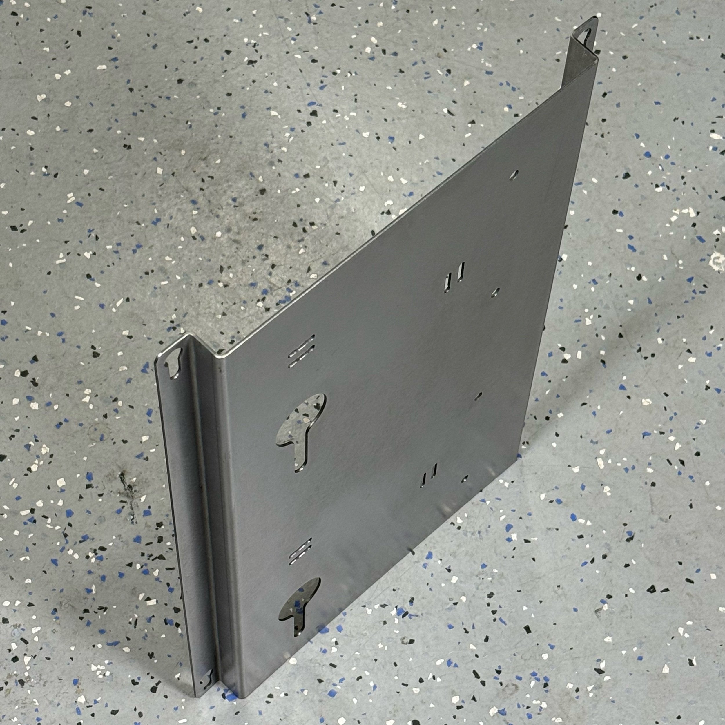 Elevate Metalcraft EGO 56 Volt double battery charger mount on steel wall, quick-release, secure for contractor service trucks and shops.