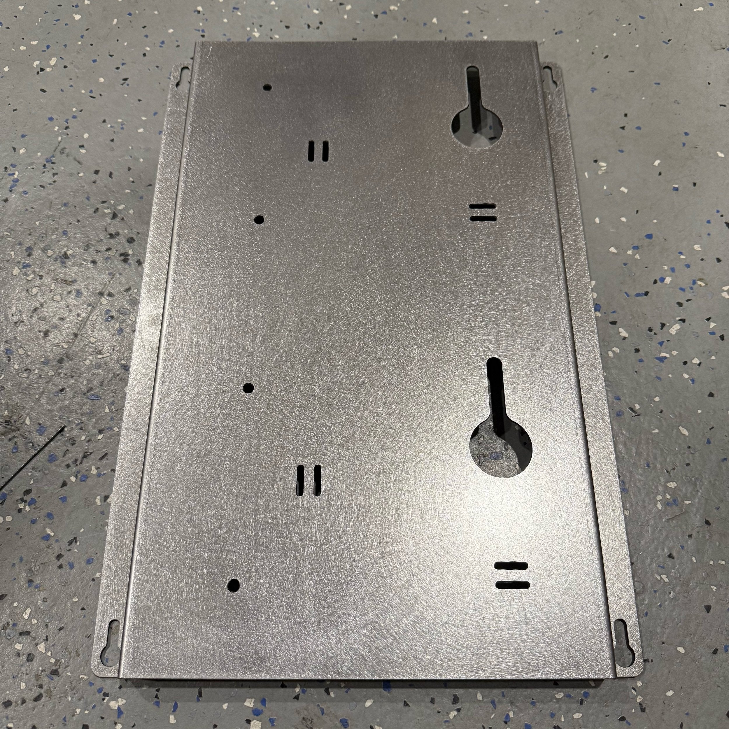 Elevate Metalcraft EGO 56 Volt double battery charger mount, steel wall mount for contractor trucks, vans, and workshops.