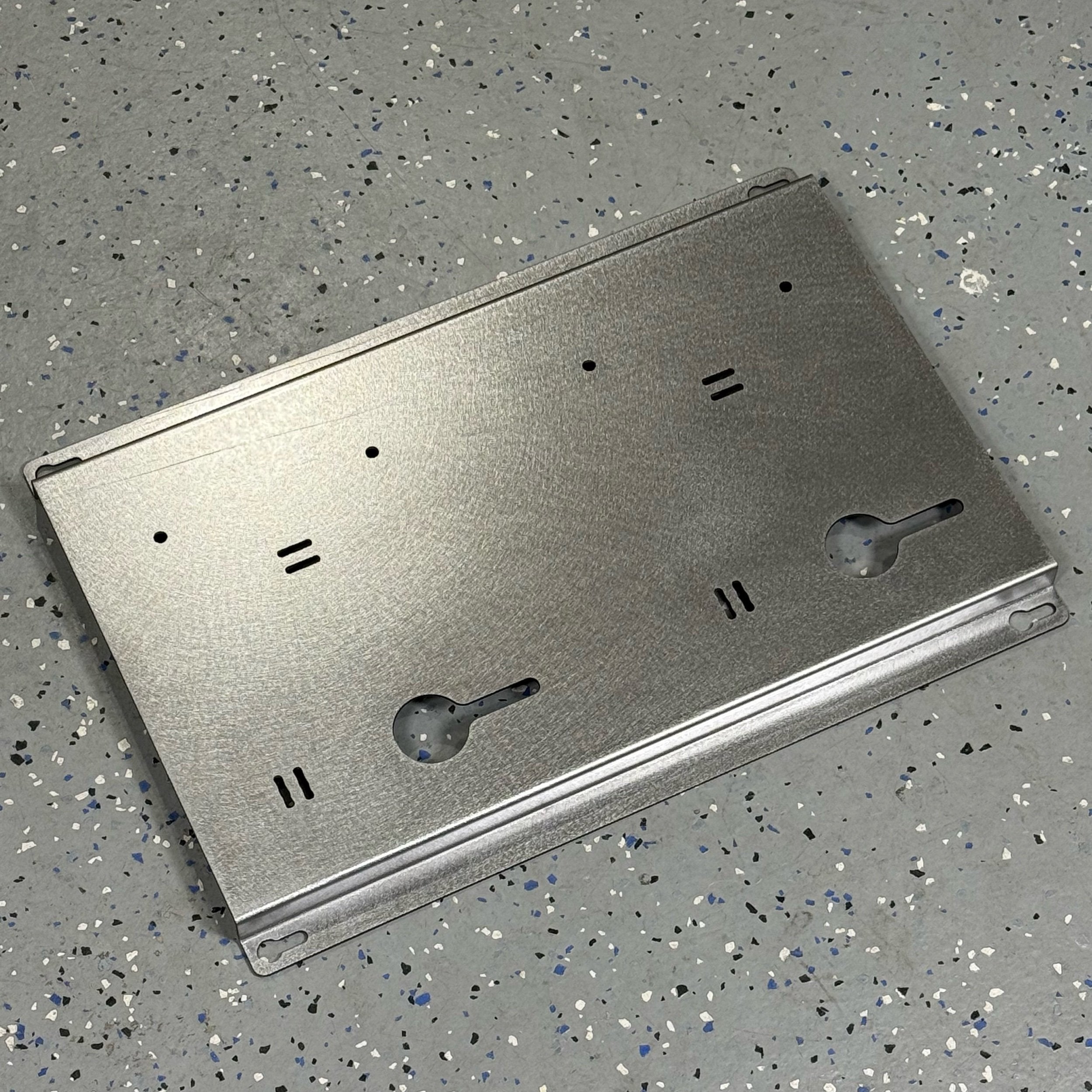 Steel wall mount for EGO 56 Volt double battery charger by Elevate Metalcraft, quick-release and secure for contractor trucks and shops.