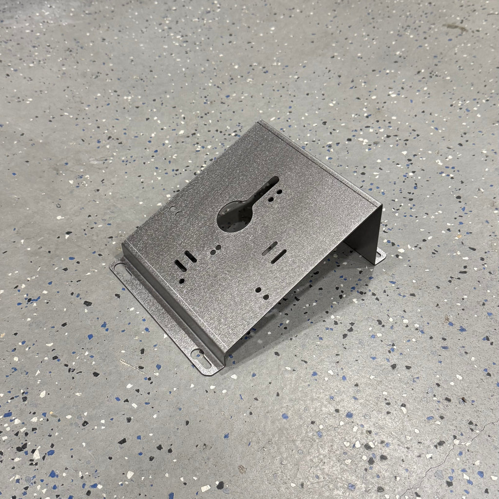 Elevate Metalcraft wall mount plate for Milwaukee M18 M12 rapid battery charger, 20-degree angle for van and truck installation.