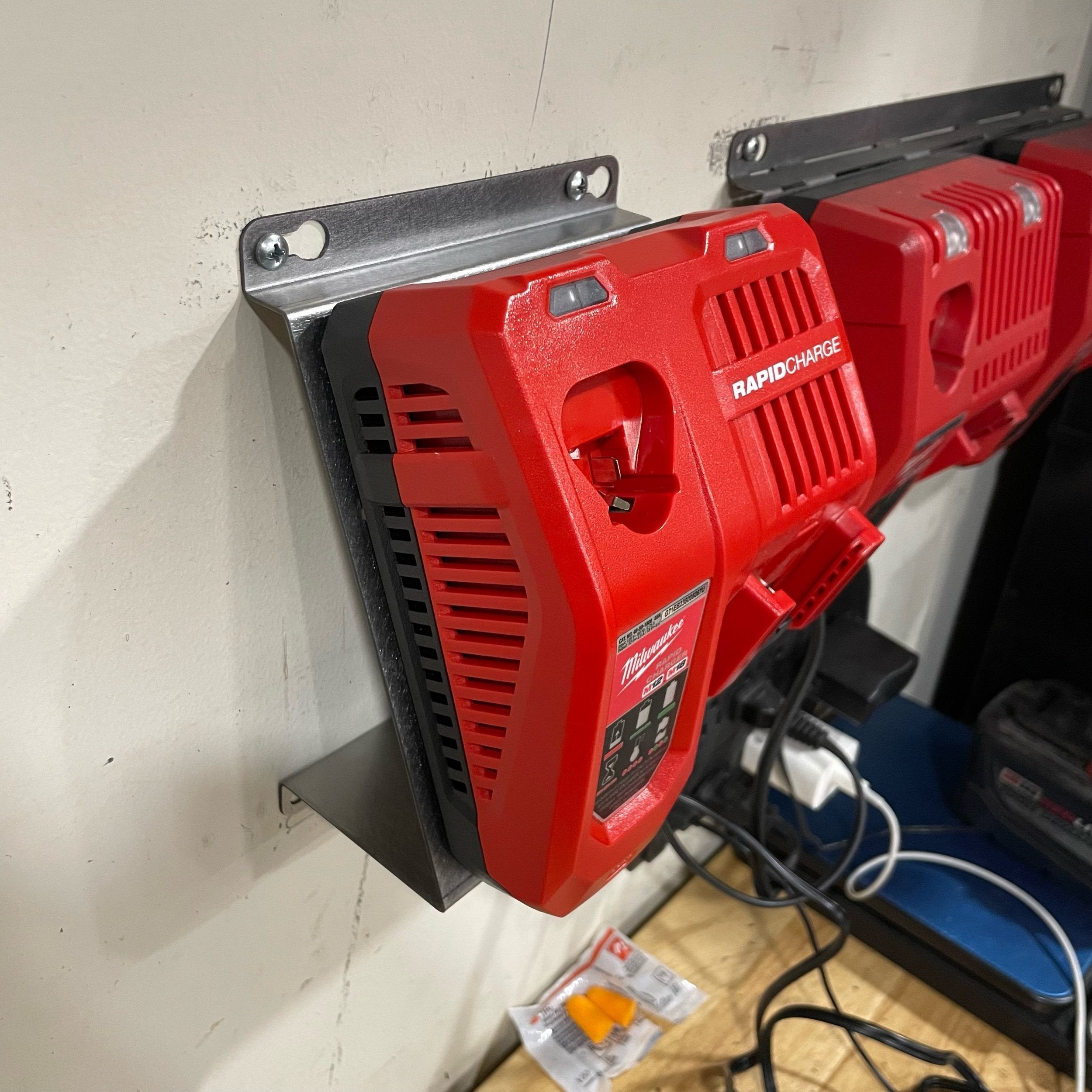 Milwaukee M18 M12 Rapid Battery Charger wall mount plate with 20-degree angle, for van, truck, or shop installation by Elevate Metalcraft.