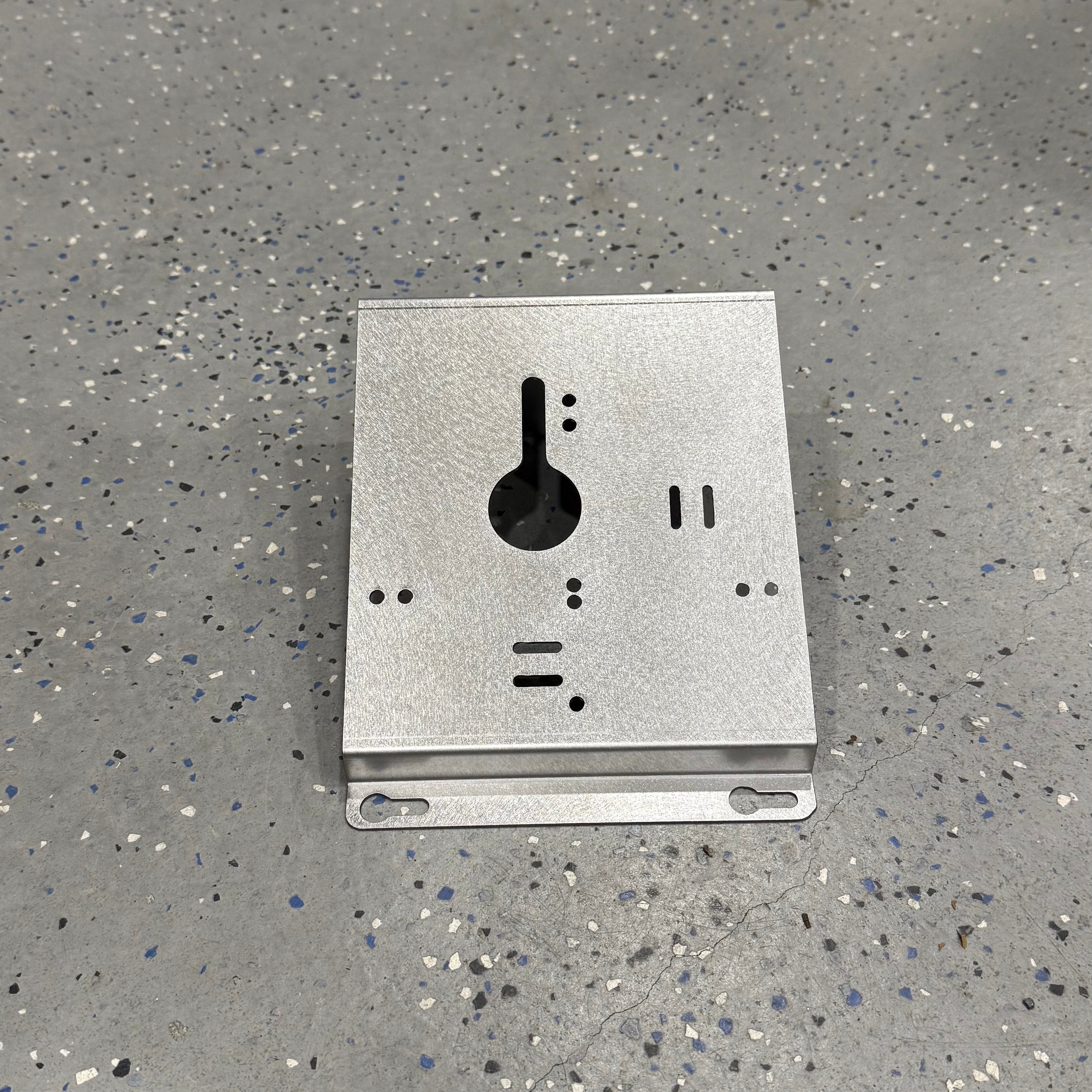 Milwaukee M18 M12 rapid battery charger wall mount plate with 20-degree angle for van, truck, or workshop by Elevate Metalcraft.
