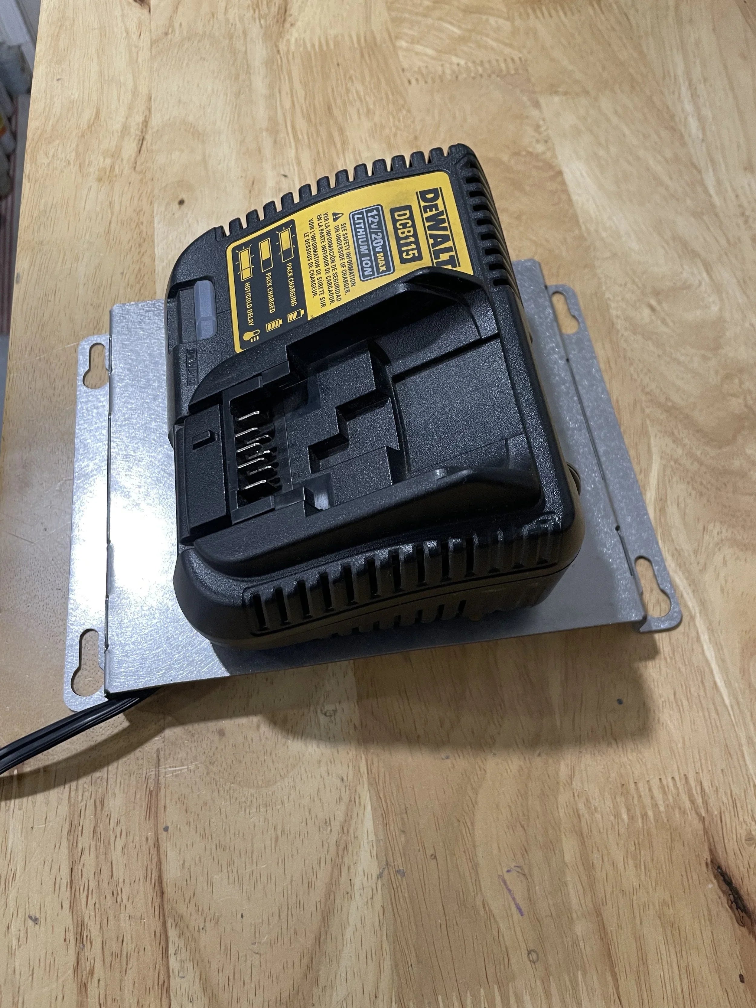 Elevate Metalcraft charger wall mount plate for Milwaukee and DeWalt tools, designed for van, truck, or shop organization.