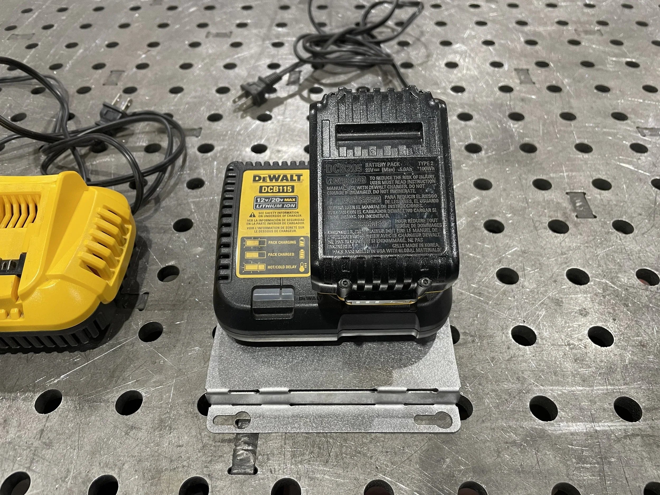 Elevate Metalcraft wall mount plate for chargers, compatible with Milwaukee and DeWalt tools, designed for vans, trucks, and shops.