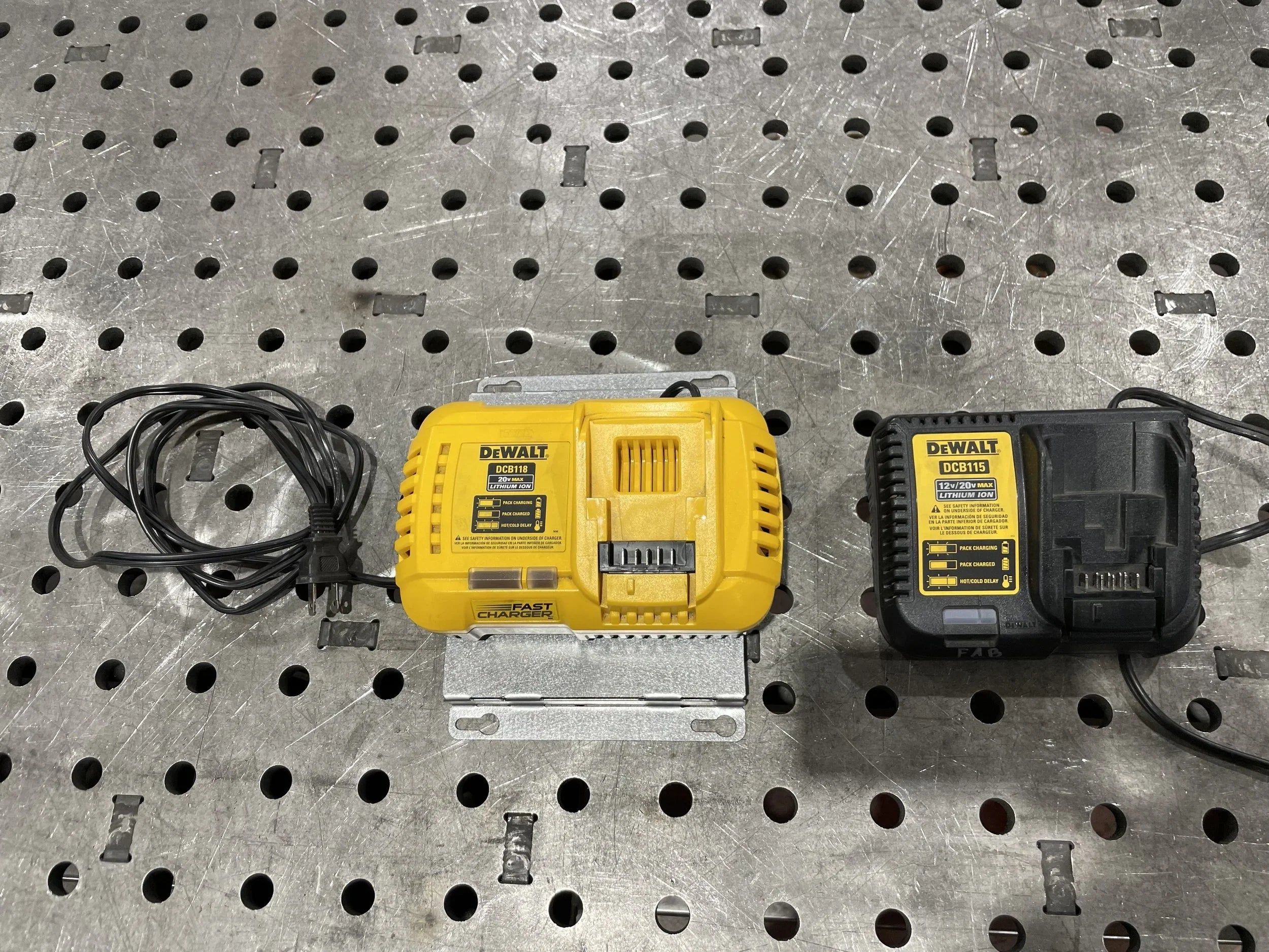 Elevate Metalcraft charger wall mount plate for Milwaukee and DeWalt power tools, designed for van, truck, or shop organization.