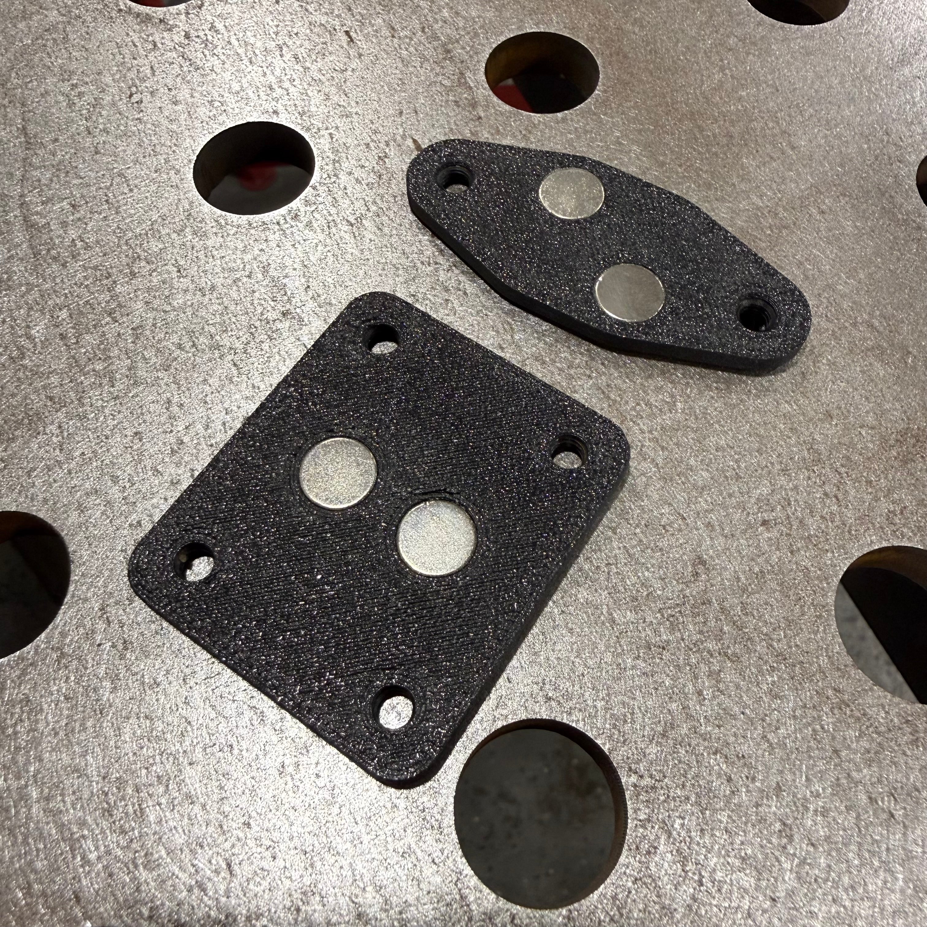 Elevate Metalcraft AMP Ball Magnetic Nut Plates with diamond-shaped design and two bolts for secure fastening.